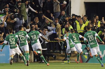 Betis' defender Alvaro Cejudo (C) celebrates after scoring during the Spanish league football match Real Betis Balompie vs Real Madrid CF at the Benito Villamarin stadium in Sevilla on January 24, 2016.  AFP PHOTO / CRISTINA QUICLER / AFP / CRISTINA QUICL