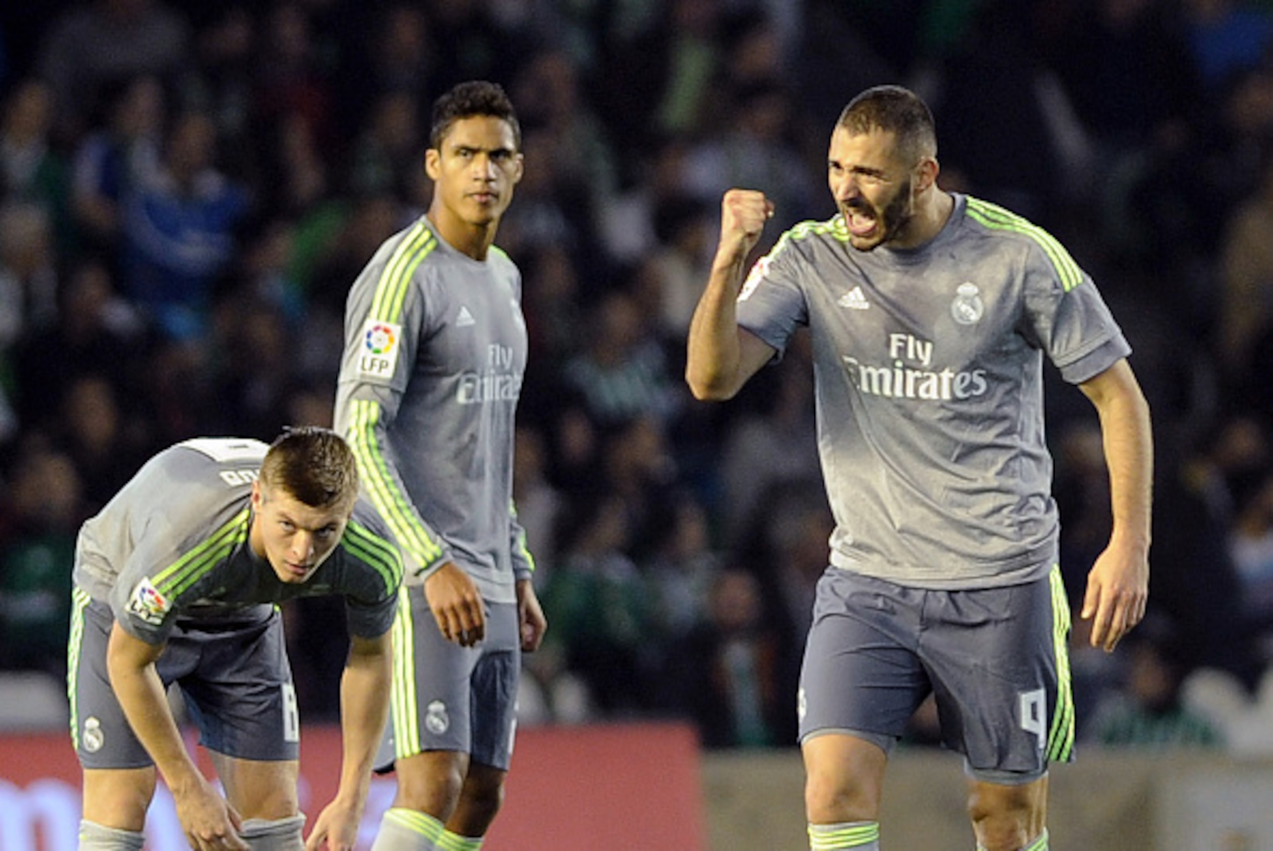 Real Madrid's French forward Karim Benzema (R) celebrates a goal during the Spanish league football match Real Betis Balompie vs Real Madrid CF at the Benito Villamarin stadium in Sevilla on January 24, 2016. AFP PHOTO / CRISTINA QUICLER / AFP / CRISTINA Real Madrid's French forward Karim Benzema (R) celebrates a goal during the Spanish league football match Real Betis Balompie vs Real Madrid CF at the Benito Villamarin stadium in Sevilla on January 24, 2016. AFP PHOTO / CRISTINA QUICLER / AFP / CRISTINA