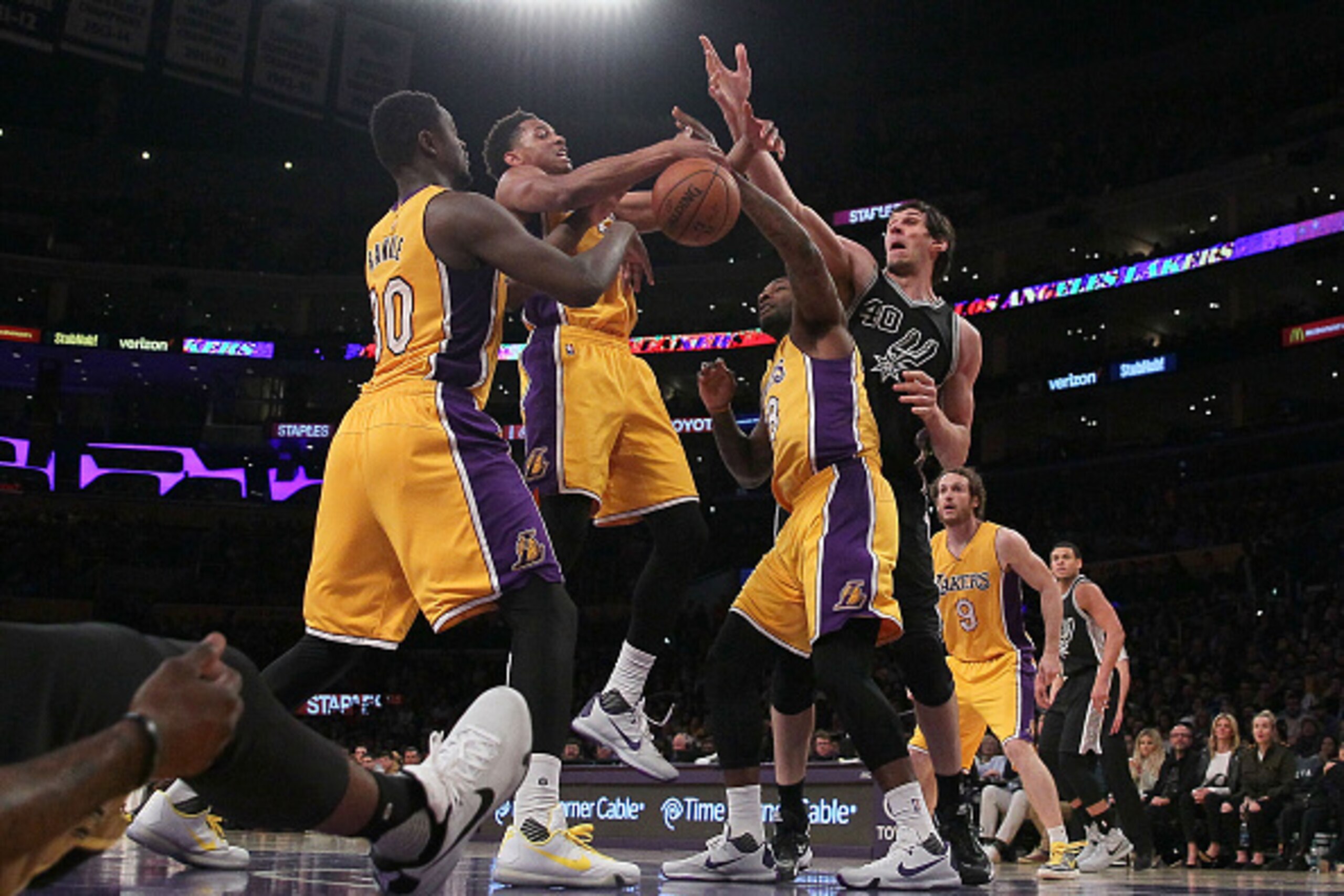 LOS ANGELES, CA - JANUARY 22: Julius Randle #30, Anthony Brown #3 and Tarik Black #28 of the Los Angeles Lakers vie for the loose ball with Boban Marjanovic #40 of the San Antonio Spurs during the NBA game at Staples Center on January 22, 2016 in Los Ang LOS ANGELES, CA - JANUARY 22: Julius Randle #30, Anthony Brown #3 and Tarik Black #28 of the Los Angeles Lakers vie for the loose ball with Boban Marjanovic #40 of the San Antonio Spurs during the NBA game at Staples Center on January 22, 2016 in Los Ang