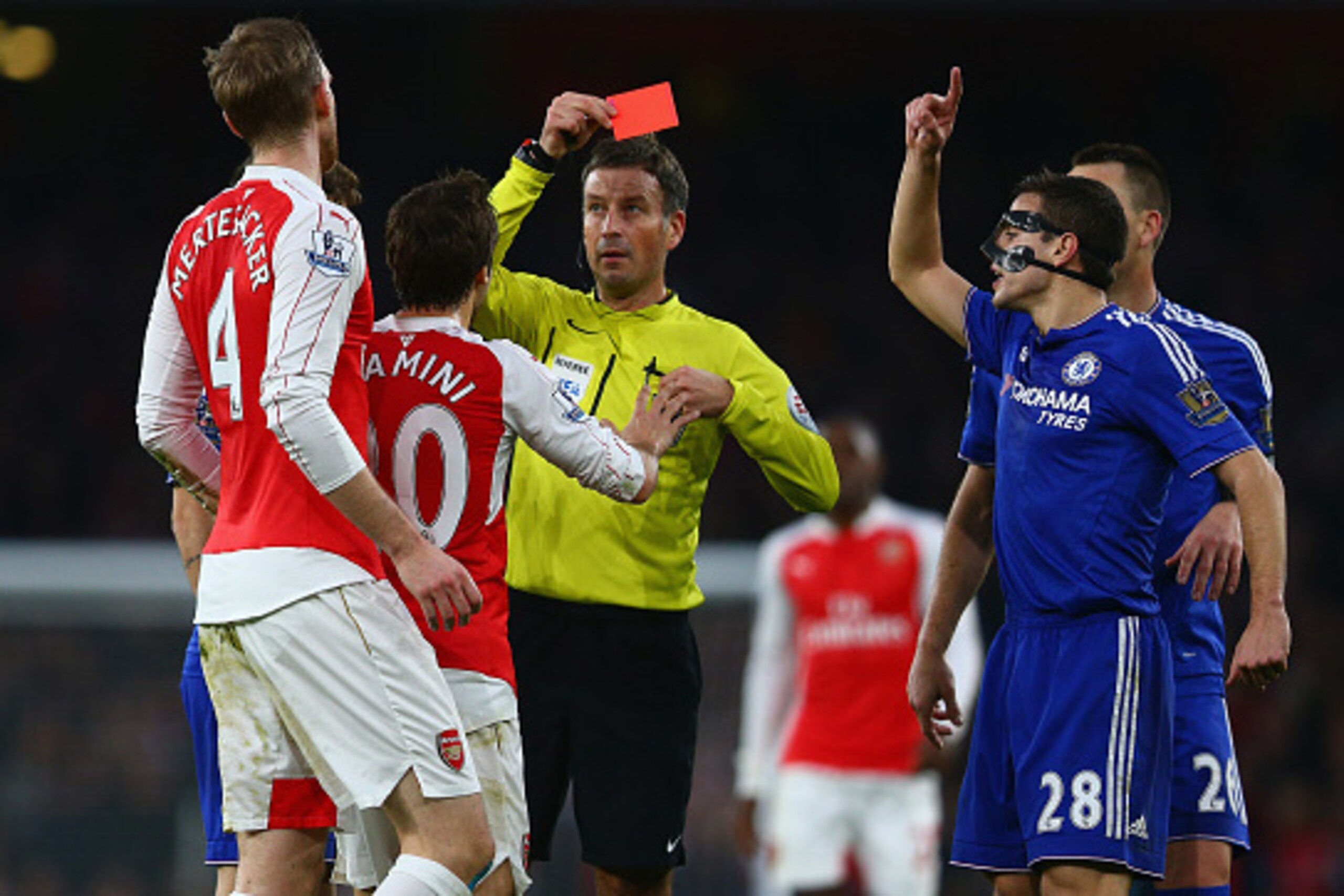 LONDON, ENGLAND - JANUARY 24: Per Mertesacker of Arsenal is shown the red card and is sent off for his challenge on Diego Costa of Chelsea during the Barclays Premier League match between Arsenal and Chelsea at The Emirates Stadium on January 24, 2016 in LONDON, ENGLAND - JANUARY 24: Per Mertesacker of Arsenal is shown the red card and is sent off for his challenge on Diego Costa of Chelsea during the Barclays Premier League match between Arsenal and Chelsea at The Emirates Stadium on January 24, 2016 in
