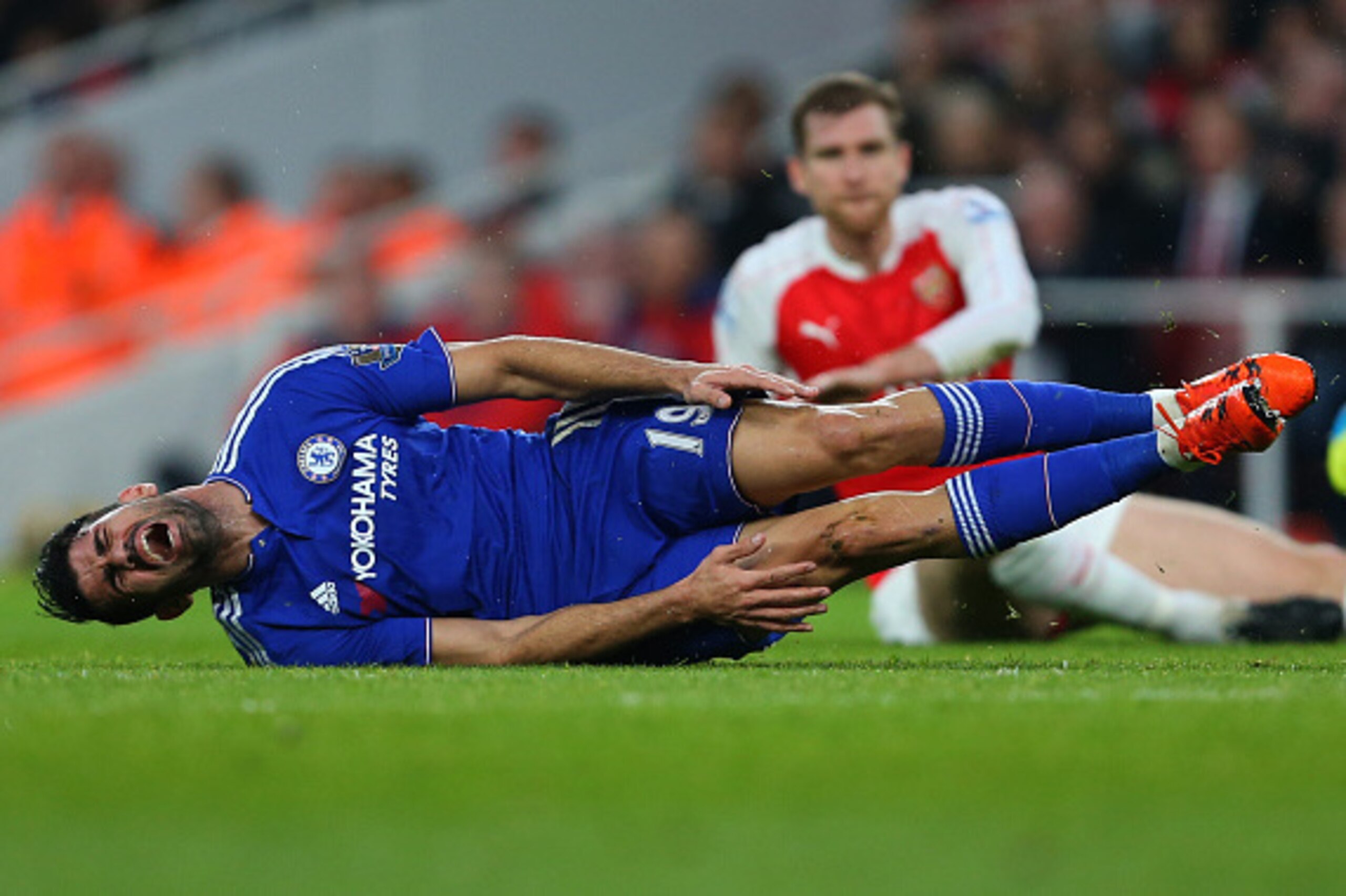 LONDON, ENGLAND - JANUARY 24: Diego Costa of Chelsea reacts after he is brought down by Per Mertesacker of Arsenal during the Barclays Premier League match between Arsenal and Chelsea at the Emirates Stadium on January 24, 2016 in London, England. (Phot LONDON, ENGLAND - JANUARY 24: Diego Costa of Chelsea reacts after he is brought down by Per Mertesacker of Arsenal during the Barclays Premier League match between Arsenal and Chelsea at the Emirates Stadium on January 24, 2016 in London, England. (Phot