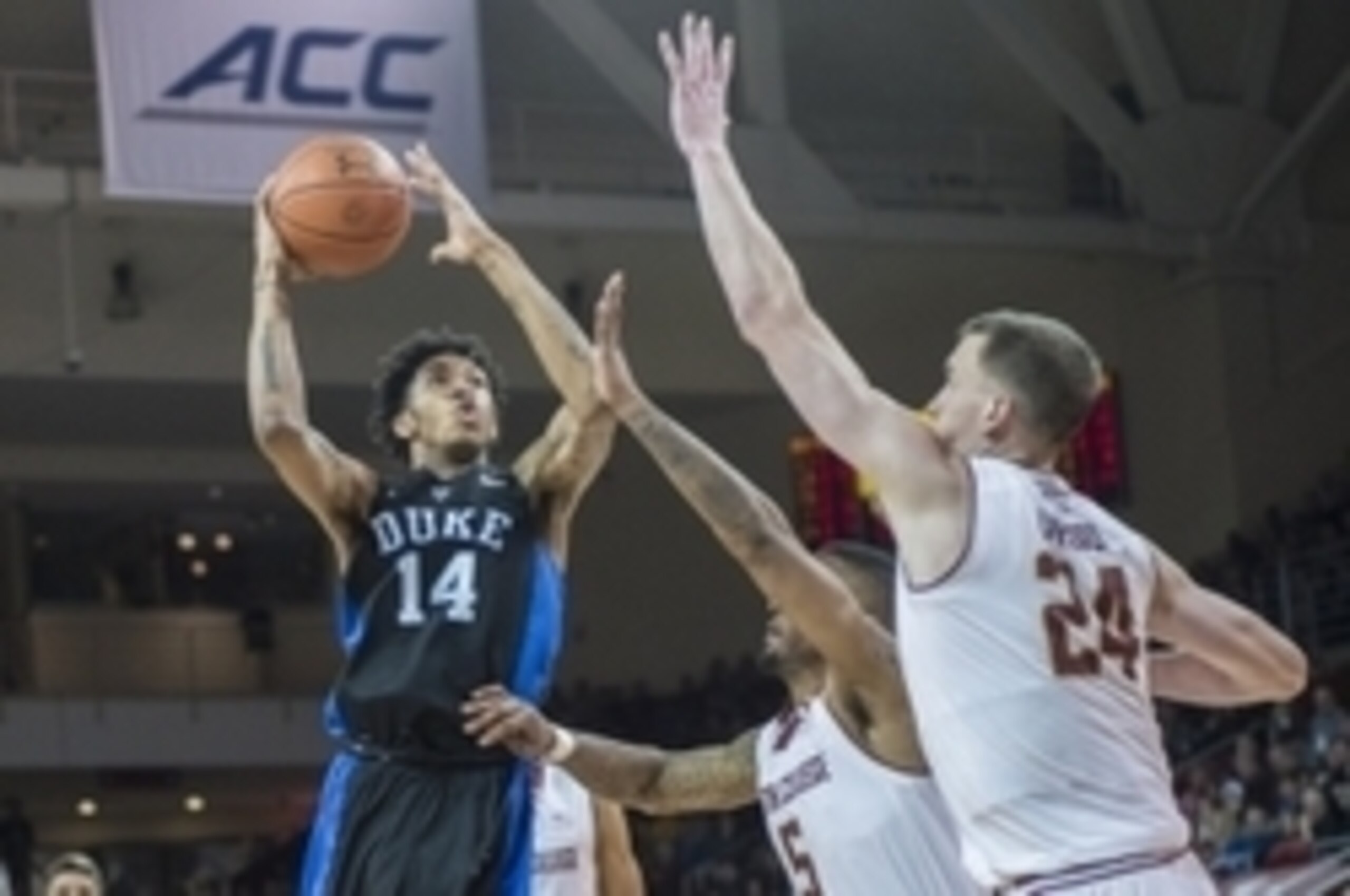 Jan 2, 2016; Chestnut Hill, MA, USA; Duke Blue Devils guard Brandon Ingram (14) shoots the ball as Boston College Eagles forward Garland Owens (5) and center Dennis Clifford (24) defend during the second half of the game at Silvio O. Conte Forum. Duke won
