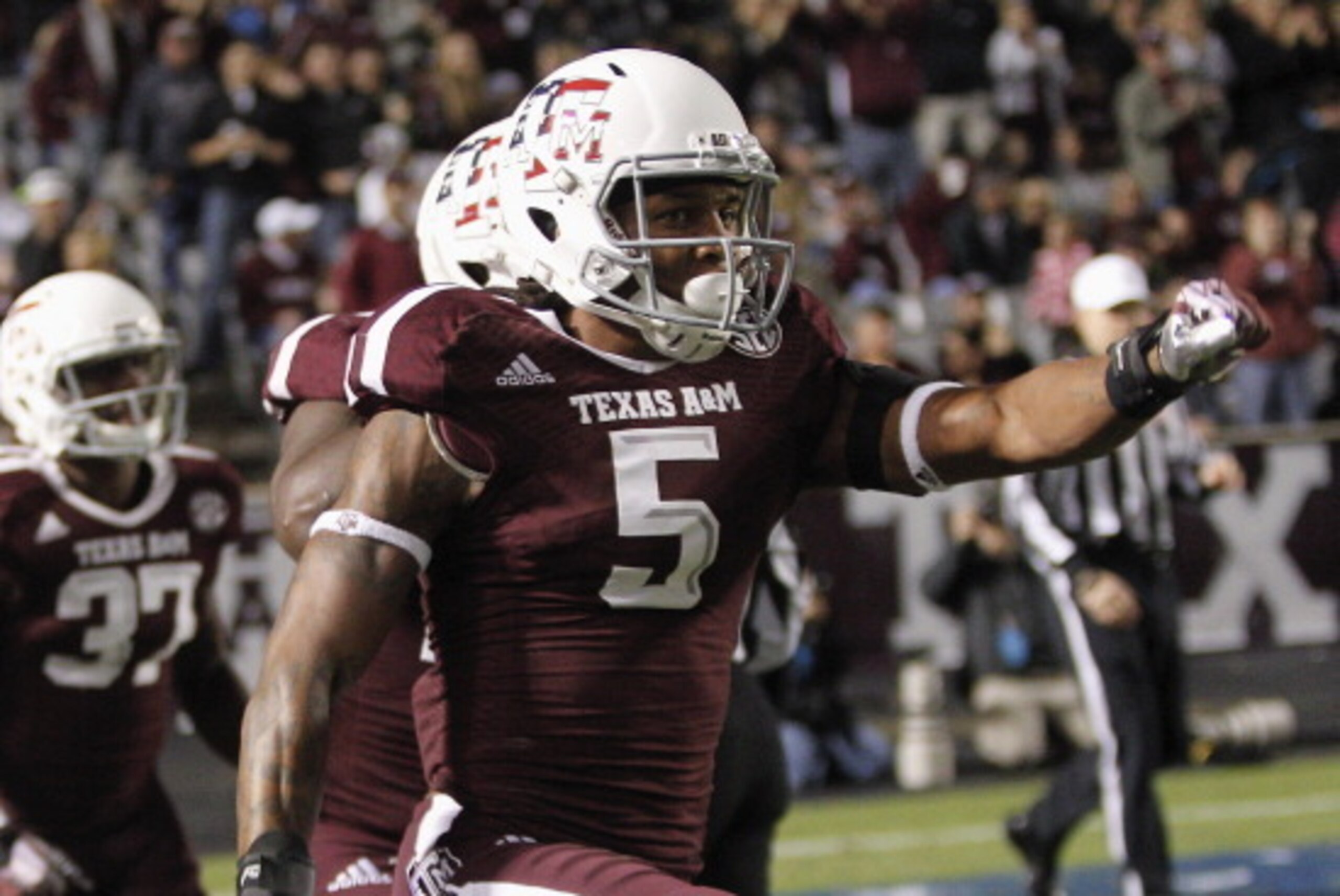 COLLEGE STATION, TX - NOVEMBER 02:  Floyd Raven Sr. #5 of the Texas A&M Aggies celebrtaes after blocking a punt by UTEP Miners for a safety in the first quarter at Kyle Field on November 2, 2013 in College Station, Texas.  (Photo by Bob Levey/Getty Images