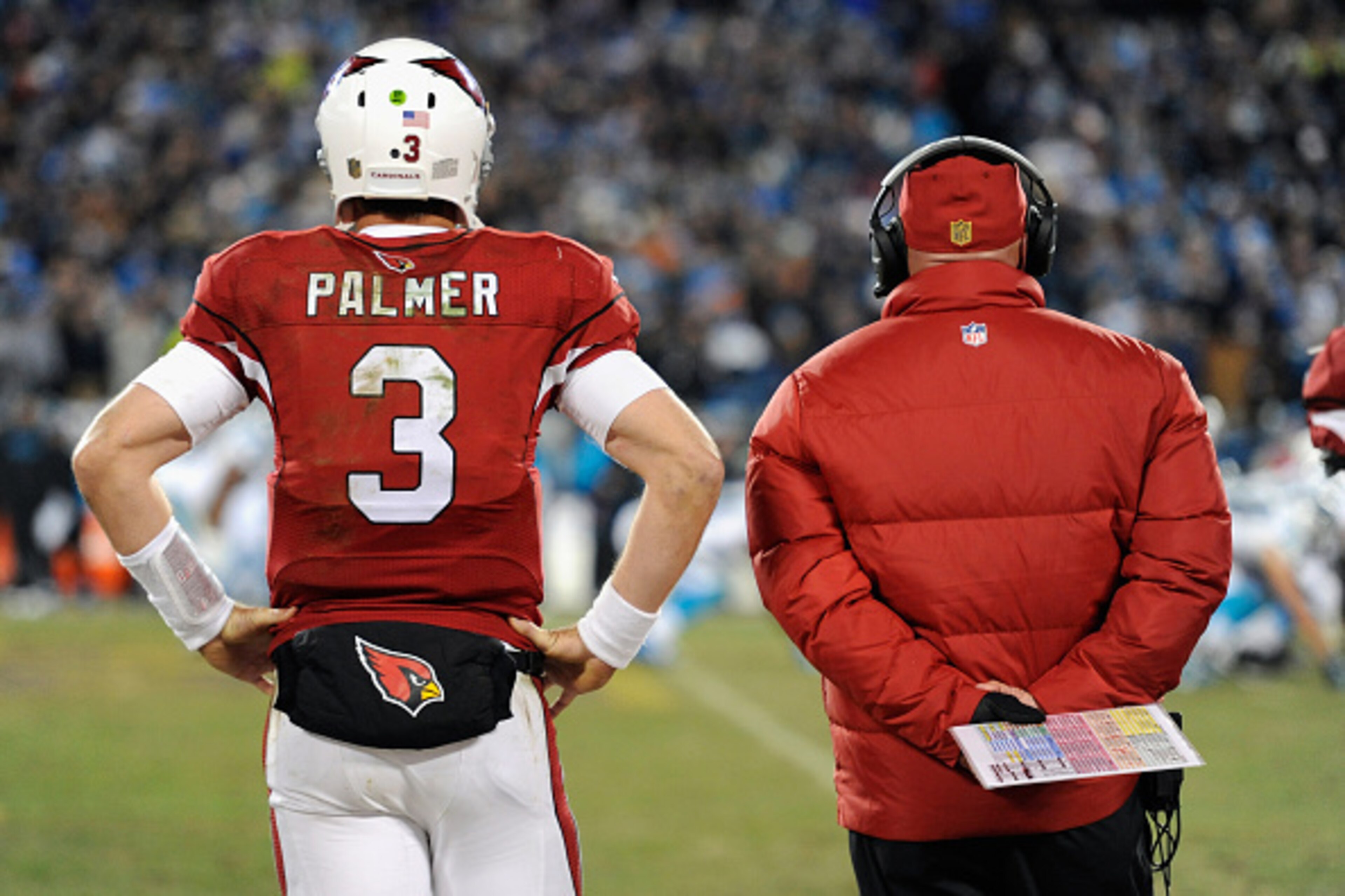 CHARLOTTE, NC - JANUARY 24:   Carson Palmer #3 and head coach Bruce Arians of the Arizona Cardinals look on during the NFC Championship Game against the Carolina Panthers at Bank of America Stadium on January 24, 2016 in Charlotte, North Carolina.  (Photo
