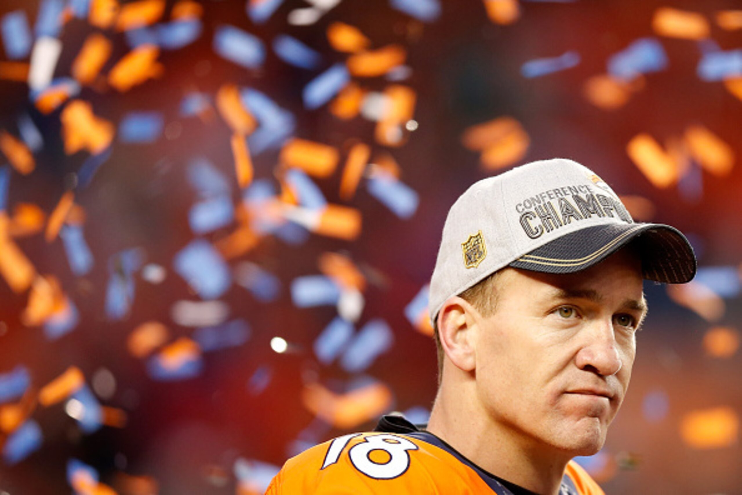 DENVER, CO - JANUARY 24:  Peyton Manning #18 of the Denver Broncos looks on after defeating the New England Patriots in the AFC Championship game at Sports Authority Field at Mile High on January 24, 2016 in Denver, Colorado. The Broncos defeated the Patr