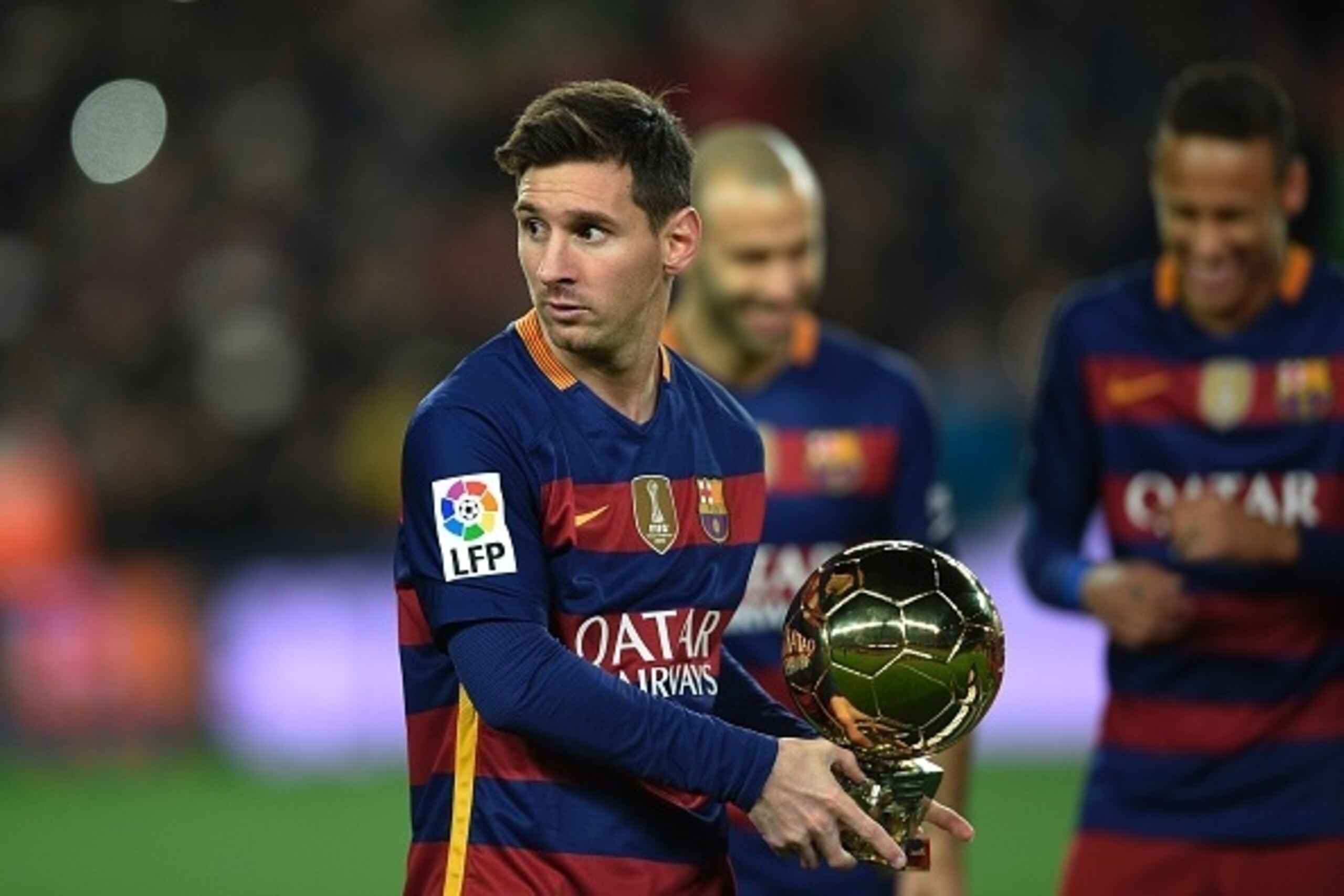Barcelona's Argentinian forward Lionel Messi walks with his fifth Ballon d'Or trophy on the pitch before the Spanish league football match FC Barcelona vs Athletic Club Bilbao at the Camp Nou stadium in Barcelona on January 17, 2016. AFP PHOTO/ LLUIS GE Barcelona's Argentinian forward Lionel Messi walks with his fifth Ballon d'Or trophy on the pitch before the Spanish league football match FC Barcelona vs Athletic Club Bilbao at the Camp Nou stadium in Barcelona on January 17, 2016. AFP PHOTO/ LLUIS GE