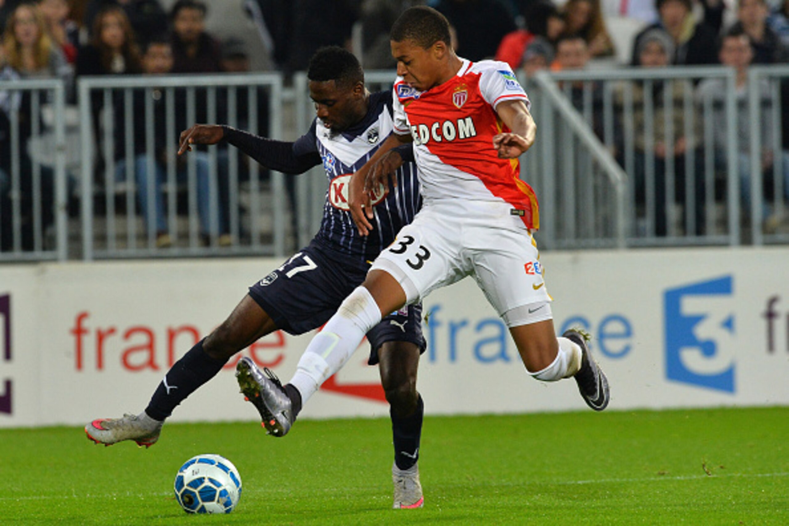 Bordeaux's Gabonese midfielder Andre Biyogo Poko (L) vies with Monaco's forward Kylian Mbappe (R) during the French League Cup football match between Bordeaux and Monaco on December 16, 2015 at the Matmut Atlantique stadium in Bordeaux, southwestern Fran Bordeaux's Gabonese midfielder Andre Biyogo Poko (L) vies with Monaco's forward Kylian Mbappe (R) during the French League Cup football match between Bordeaux and Monaco on December 16, 2015 at the Matmut Atlantique stadium in Bordeaux, southwestern Fran