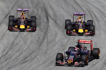 KUALA LUMPUR, MALAYSIA - MARCH 29:  Daniel Ricciardo of Australia and Infiniti Red Bull Racing and Daniil Kvyat of Russia and Infiniti Red Bull Racing drive next to Max Verstappen of Netherlands and Scuderia Toro Rosso during the Malaysia Formula One Gran