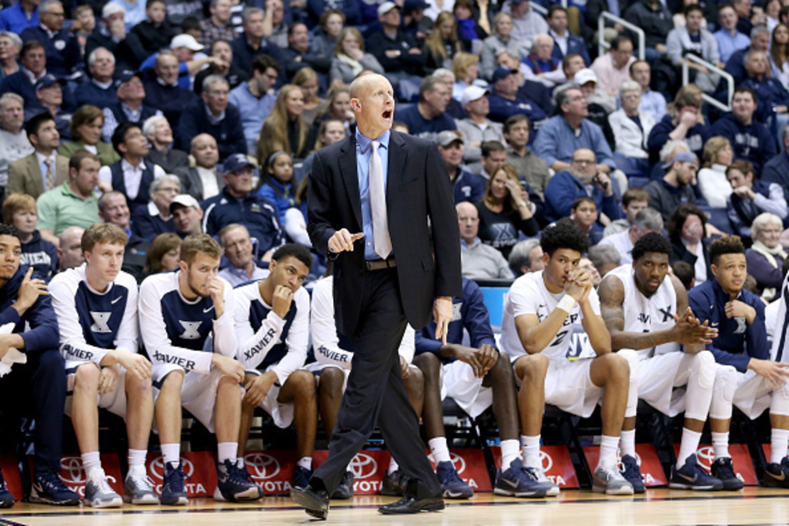 CINCINNATI, OH - JANUARY 19:  Chris Mack the head coach of the Xavier Musketeers gives instructions to his team against the Georgetown Hoyas at Cintas Center on January 19, 2016 in Cincinnati, Ohio.  (Photo by Andy Lyons/Getty Images)