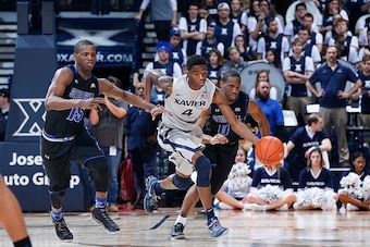 CINCINNATI, OH - JANUARY 23: Edmond Sumner #4 of the Xavier Musketeers brings the ball up court against Isaiah Whitehead #15 of the Seton Hall Pirates during the game at Cintas Center on January 23, 2016 in Cincinnati, Ohio. Xavier defeated Seton Hall 84-