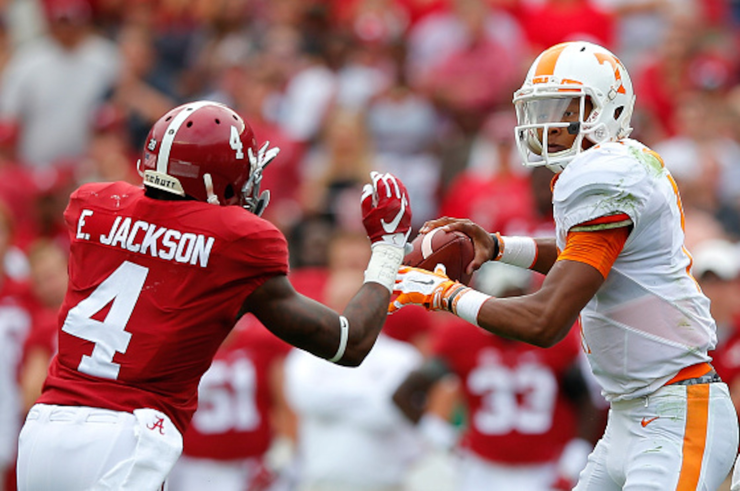 TUSCALOOSA, AL - OCTOBER 24:  Joshua Dobbs #11 of the Tennessee Volunteers is pressured by Eddie Jackson #4 of the Alabama Crimson Tide at Bryant-Denny Stadium on October 24, 2015 in Tuscaloosa, Alabama.  (Photo by Kevin C. Cox/Getty Images)