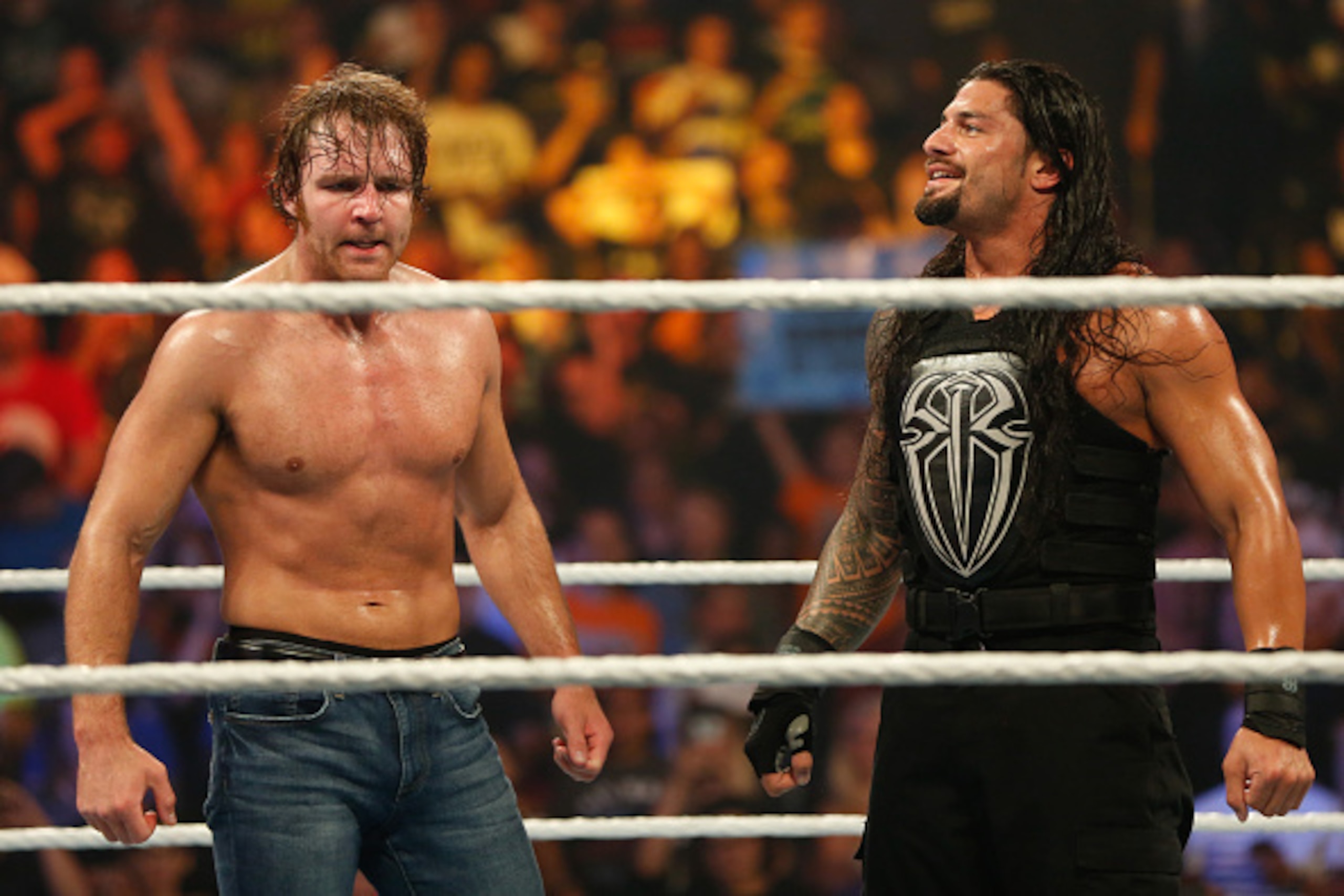 NEW YORK, NY - AUGUST 23:  Dean Ambrose and Roman Reigns celebrate their victory at the WWE SummerSlam 2015 at Barclays Center of Brooklyn on August 23, 2015 in New York City.  (Photo by JP Yim/Getty Images)