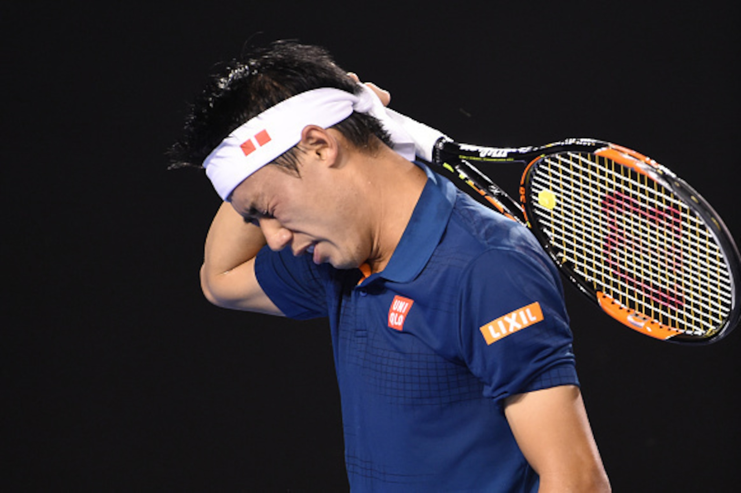 Japan's Kei Nishikori reacts during his men's singles match against Serbia's Novak Djokovic on day nine of the 2016 Australian Open tennis tournament in Melbourne on January 26, 2016. AFP PHOTO / WILLIAM WEST-- IMAGE RESTRICTED TO EDITORIAL USE - STRICTLY
