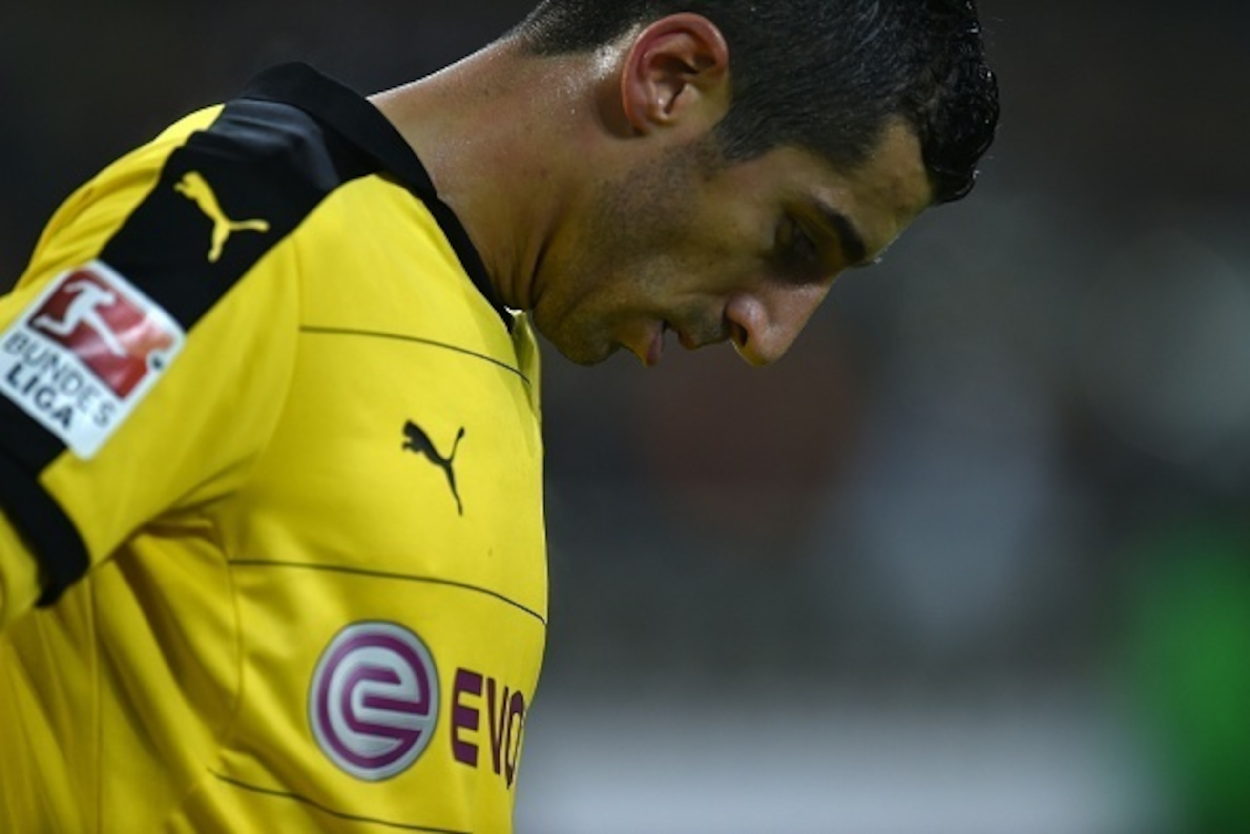 Dortmund's Armenian midfielder Henrikh Mkhitaryan reacts during the German first division football Bundesliga match Borussia Moenchengladbach vs Borussia Dortmund in Moenchengladbach, western Germany, on January 23, 2016. / AFP / PATRIK STOLLARZ / RESTRIC