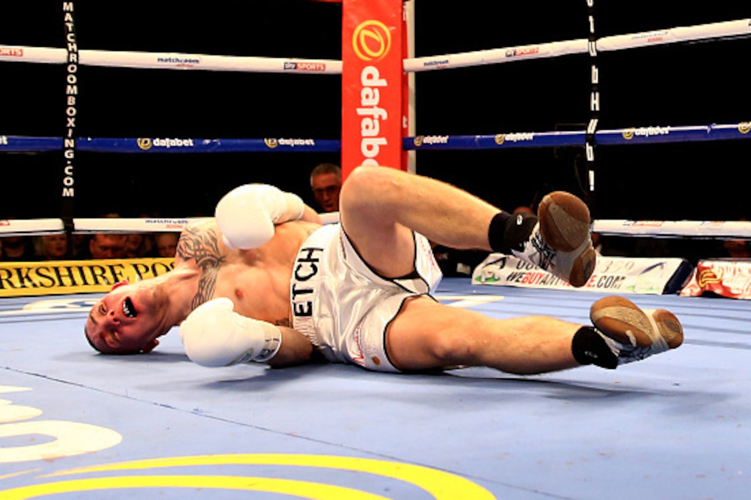 SHEFFIELD, ENGLAND - MARCH 28:  Adam Etches of Great Britain is knocked out by Sergei Khomitsky of Belarus during the IBF international middleweight championship fight at Motorpoint Arena on March 28, 2015 in Sheffield, England.  (Photo by Richard Heathco
