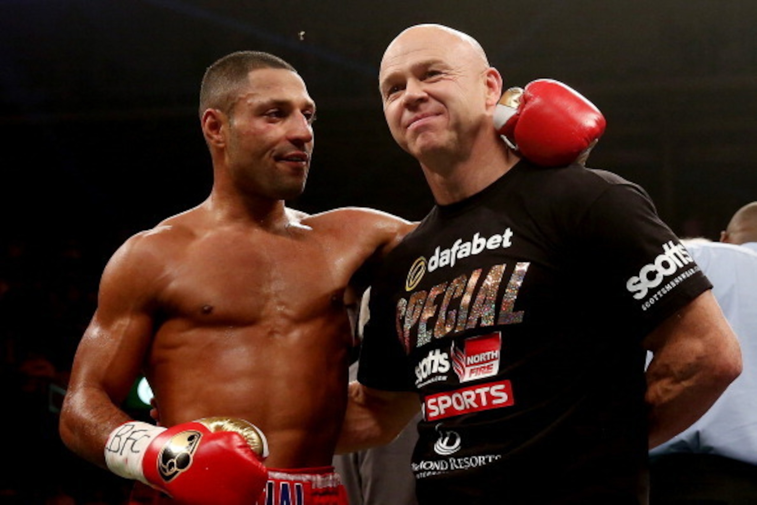 SHEFFIELD, ENGLAND - OCTOBER 26:  Kell Brook celebrates his victory over Vyacheslav Senchenko with Dominic Ingle during their Final Eliminator for the IBF World Welterweight Championship bout at Motorpoint Arena on October 26, 2013 in Sheffield, England. 
