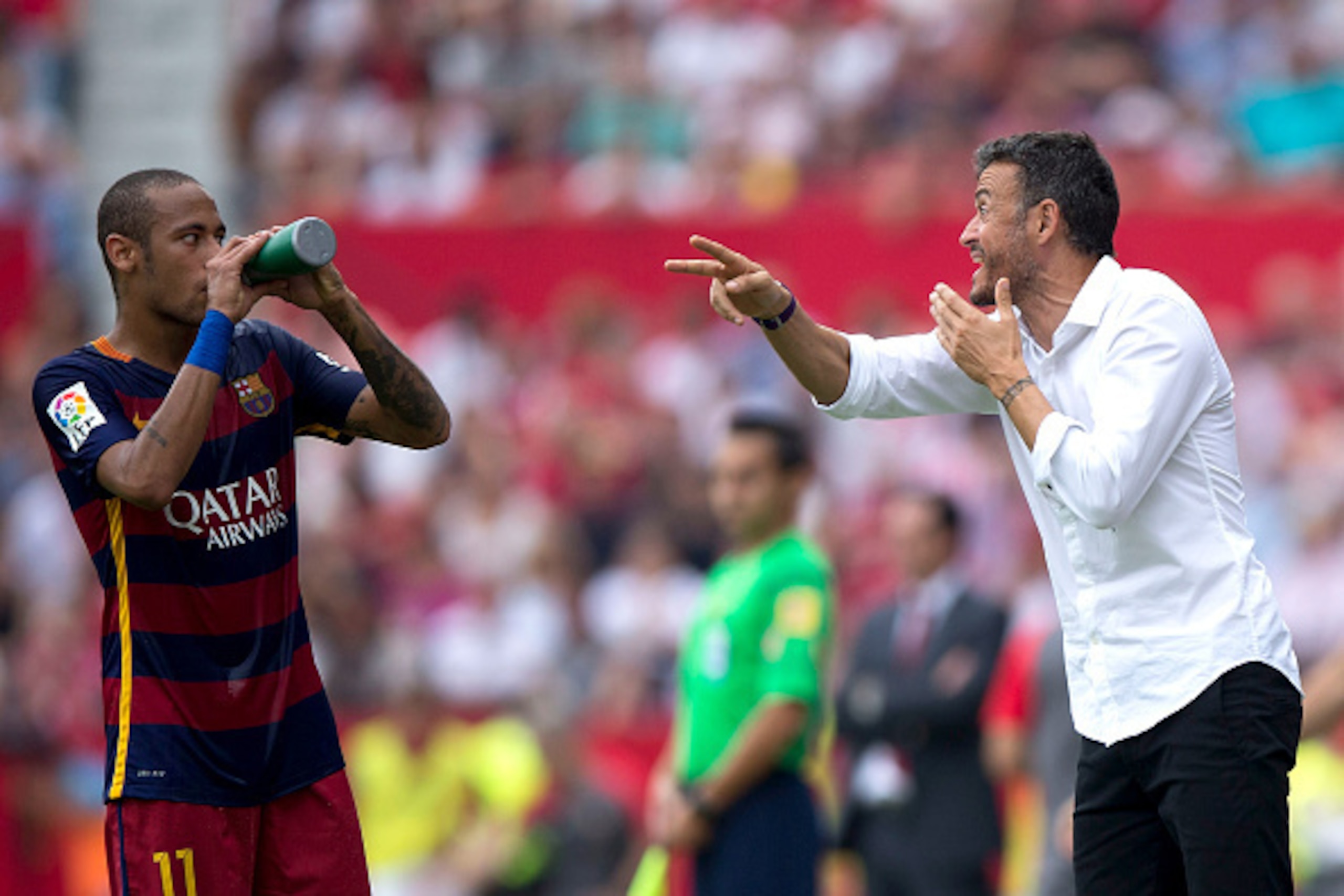 SEVILLE, SPAIN - OCTOBER 03: Head coach Luis Enrique Martinez (R) of FC Barcelona gives instructions to his player Neymar JR. (L) during the La Liga match between Sevilla FC and FC Barcelona at Estadio Ramon Sanchez Pizjuan on October 3, 2015 in Seville, 