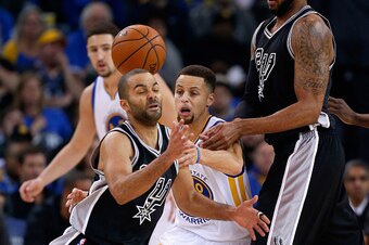 OAKLAND, CA - JANUARY 25:  Stephen Curry #30 of the Golden State Warriors forces Tony Parker #9 of the San Antonio Spurs to turn over the ball at ORACLE Arena on January 25, 2016 in Oakland, California. NOTE TO USER: User expressly acknowledges and agrees