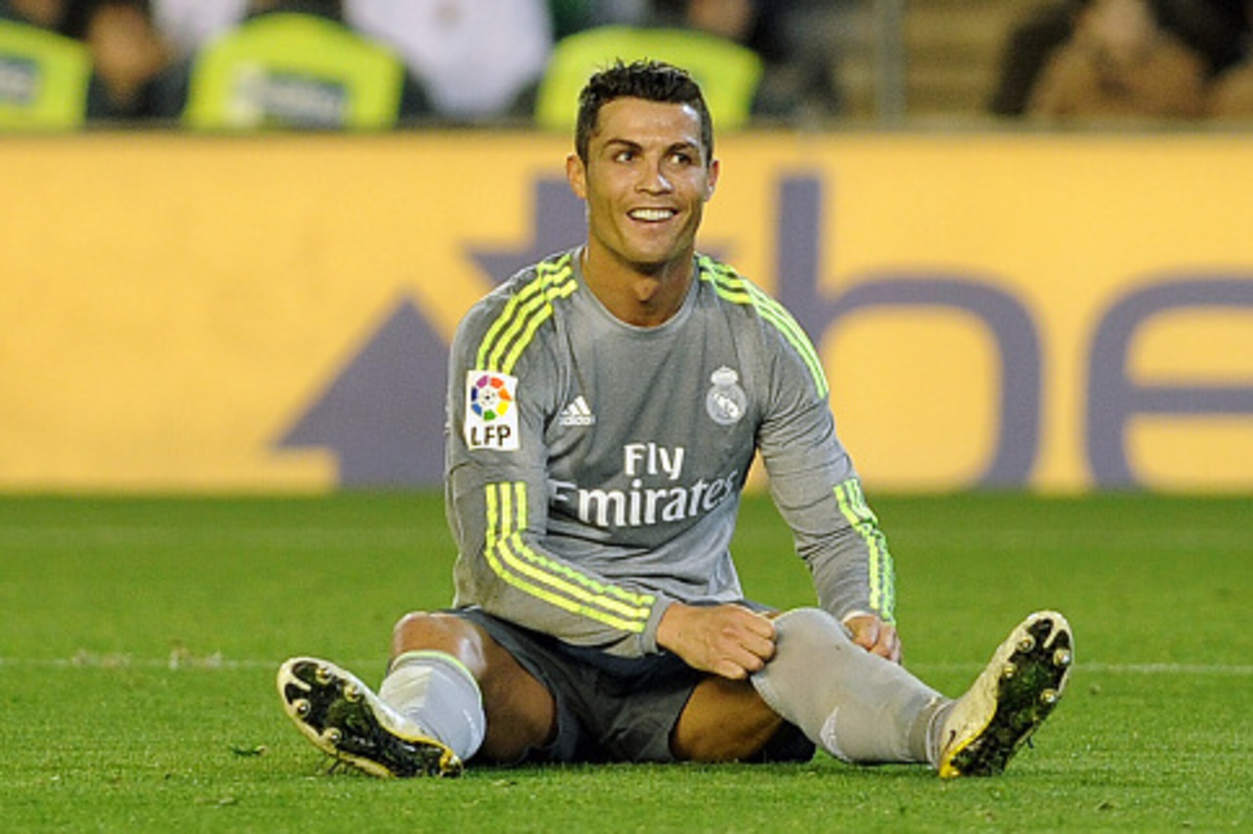 Real Madrid's Portuguese forward Cristiano Ronaldo smiles during the Spanish league football match Real Betis Balompie vs Real Madrid CF at the Benito Villamarin stadium in Sevilla on January 24, 2016.The match ended in a draw 1-1.  AFP PHOTO / CRISTINA Q