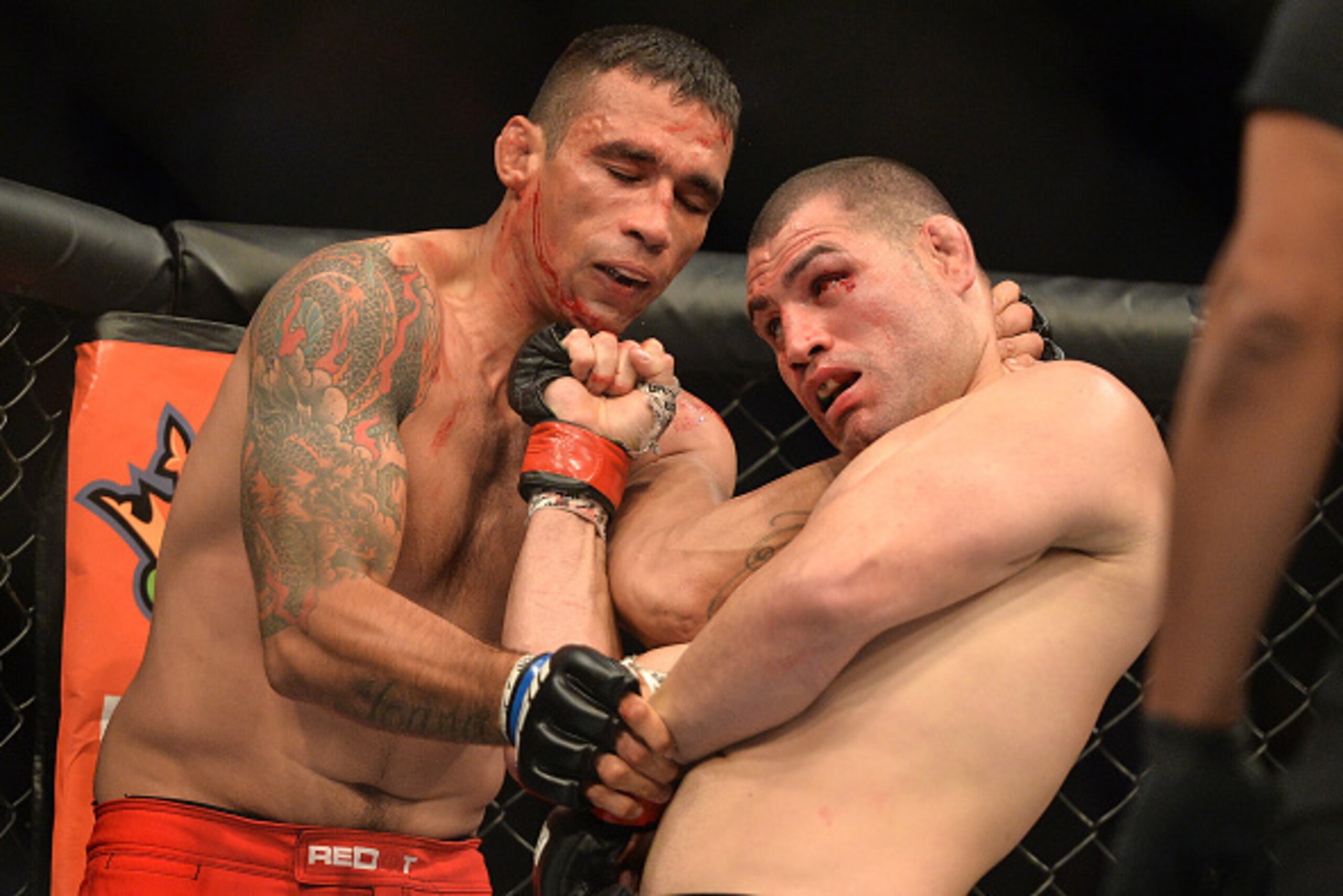 MEXICO CITY, MEXICO - JUNE 13:  (R-L) Cain Velasquez of the United States punches Fabricio Werdum of Brazil in their UFC heavyweight championship bout during the UFC 188 event inside the Arena Ciudad de Mexico on June 13, 2015 in Mexico City, Mexico. (Pho