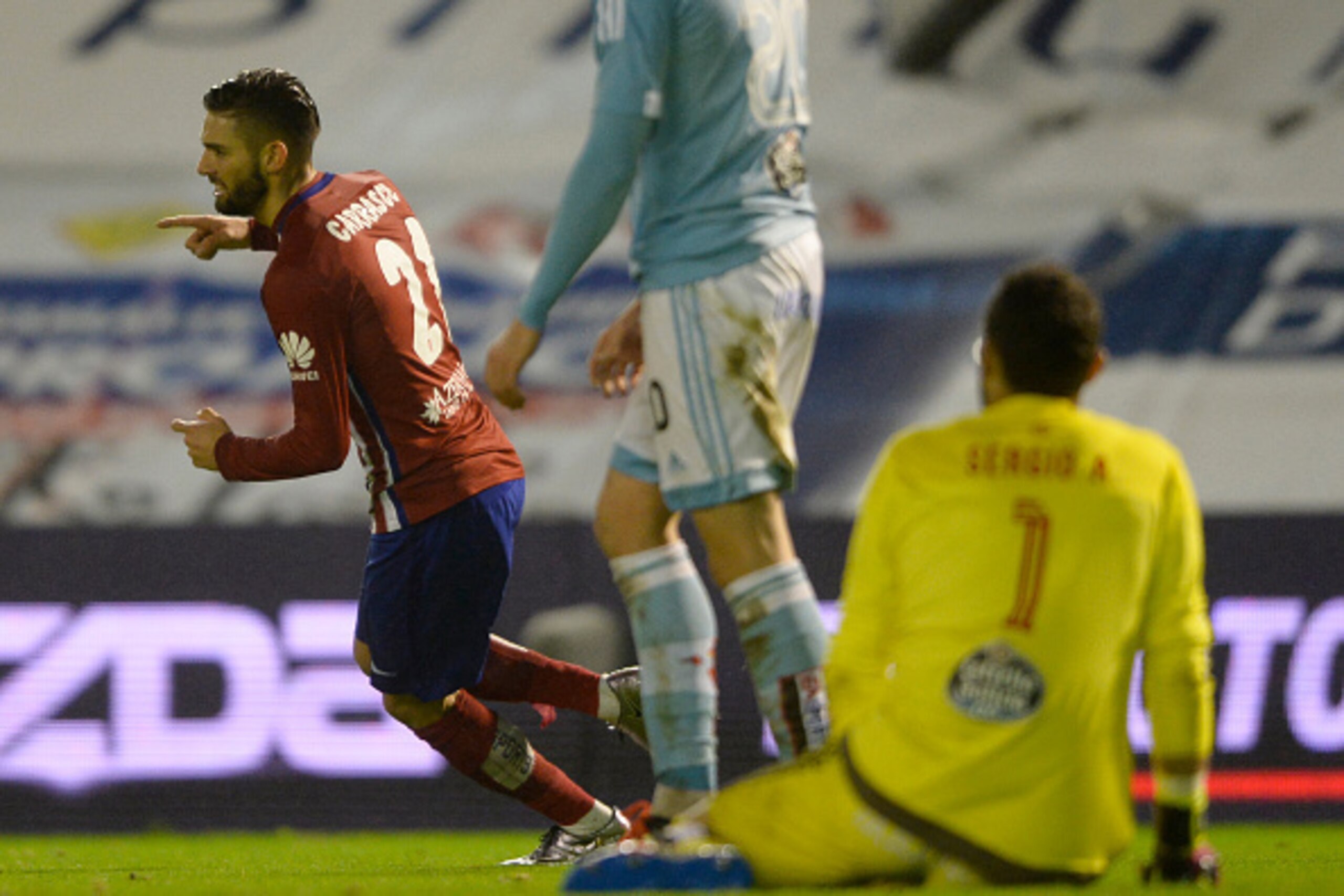 Atletico Madrid's Belgian midfielder Yannick Ferreira Carrasco celebrates after scoring a goal during the Spanish league football match RC Celta de Vigo vs Club Atletico de Madrid at the Balaidos stadium in Vigo on January 10, 2016. Atletico won the match
