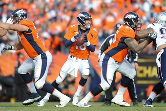 DENVER, CO - JANUARY 24:  Peyton Manning #18 of the Denver Broncos drops back to pass against the New England Patriots  in the AFC Championship game at Sports Authority Field at Mile High on January 24, 2016 in Denver, Colorado.  (Photo by Dustin Bradford