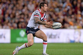 BRISBANE, AUSTRALIA - SEPTEMBER 25:  Mitchell Pearce of the Roosters passes the ball during the NRL First Preliminary Final match between the Brisbane Broncos and the Sydney Roosters at Suncorp Stadium on September 25, 2015 in Brisbane, Australia.  (Photo