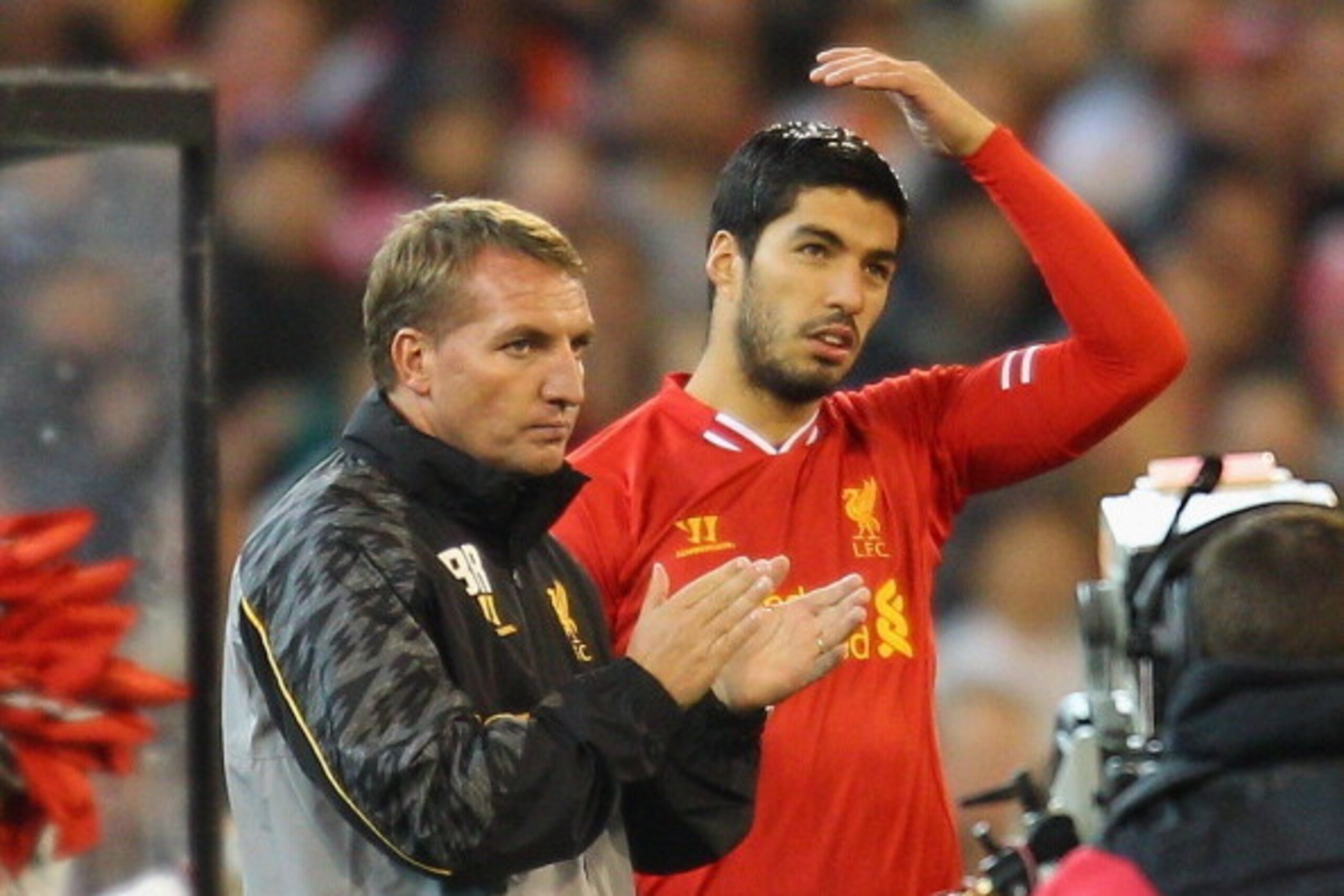 MELBOURNE, AUSTRALIA - JULY 24:  Liverpool FC Manager Brendan Rodgers (L) looks on as Luis Suarez of Liverpool is substituted into the match during the match between the Melbourne Victory and Liverpool at the Melbourne Cricket Ground on July 24, 2013 in M