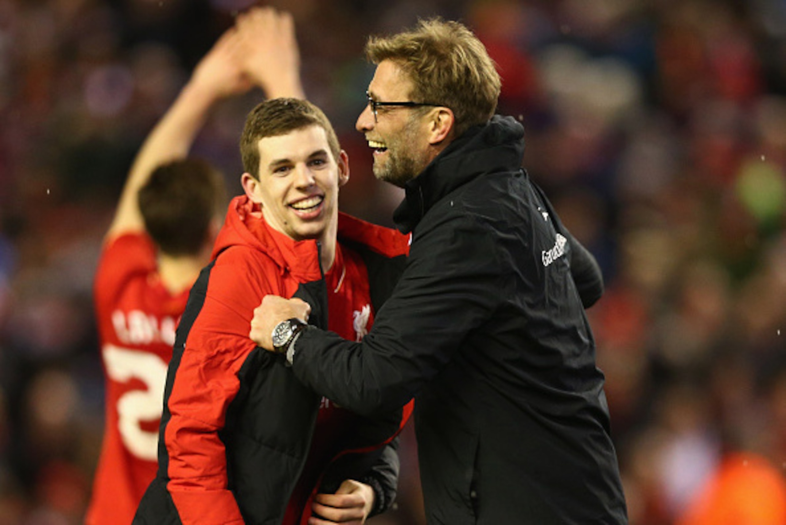 LIVERPOOL, ENGLAND - JANUARY 26:  Jurgen Klopp manager of Liverpool and Jon Flanagan of Liverpool celebrate victory in the penalty shoot out after the Capital One Cup semi final second leg match between Liverpool and Stoke City at Anfield on January 26, 2