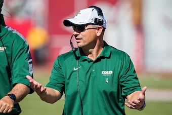 FAYETTEVILLE, AR - OCTOBER 25:  Head Coach Bill Clark of the UAB Blazers on the sidelines during a game against the Arkansas Razorbacks at Razorback Stadium on October 25, 2014 in Fayetteville, Arkansas.  The Razorbacks defeated the Blazers 45-17.  (Photo