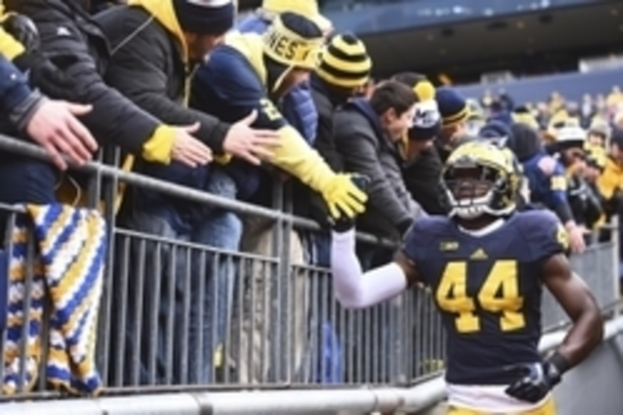 Nov 28, 2015; Ann Arbor, MI, USA; Michigan Wolverines safety Delano Hill (44) greets fans before the game against the Ohio State Buckeyes at Michigan Stadium. Mandatory Credit: Tim Fuller-USA TODAY Sports Nov 28, 2015; Ann Arbor, MI, USA; Michigan Wolverines safety Delano Hill (44) greets fans before the game against the Ohio State Buckeyes at Michigan Stadium. Mandatory Credit: Tim Fuller-USA TODAY Sports