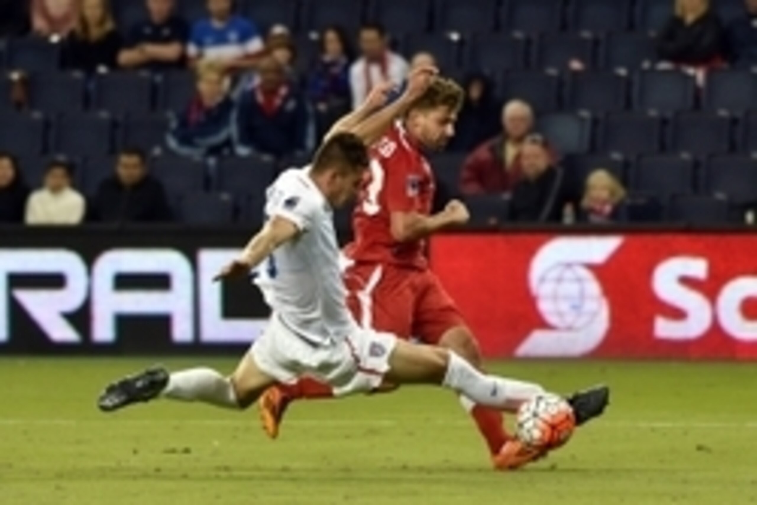 Oct 1, 2015; Kansas City, MO, USA; USA defender Matthew Miazga (3) deflects the shot of Canada forward Michael Perasso (13) during the second half at Sporting Park. The USA defeated Canada 3-1. Mandatory Credit: Peter G. Aiken-USA TODAY Sports