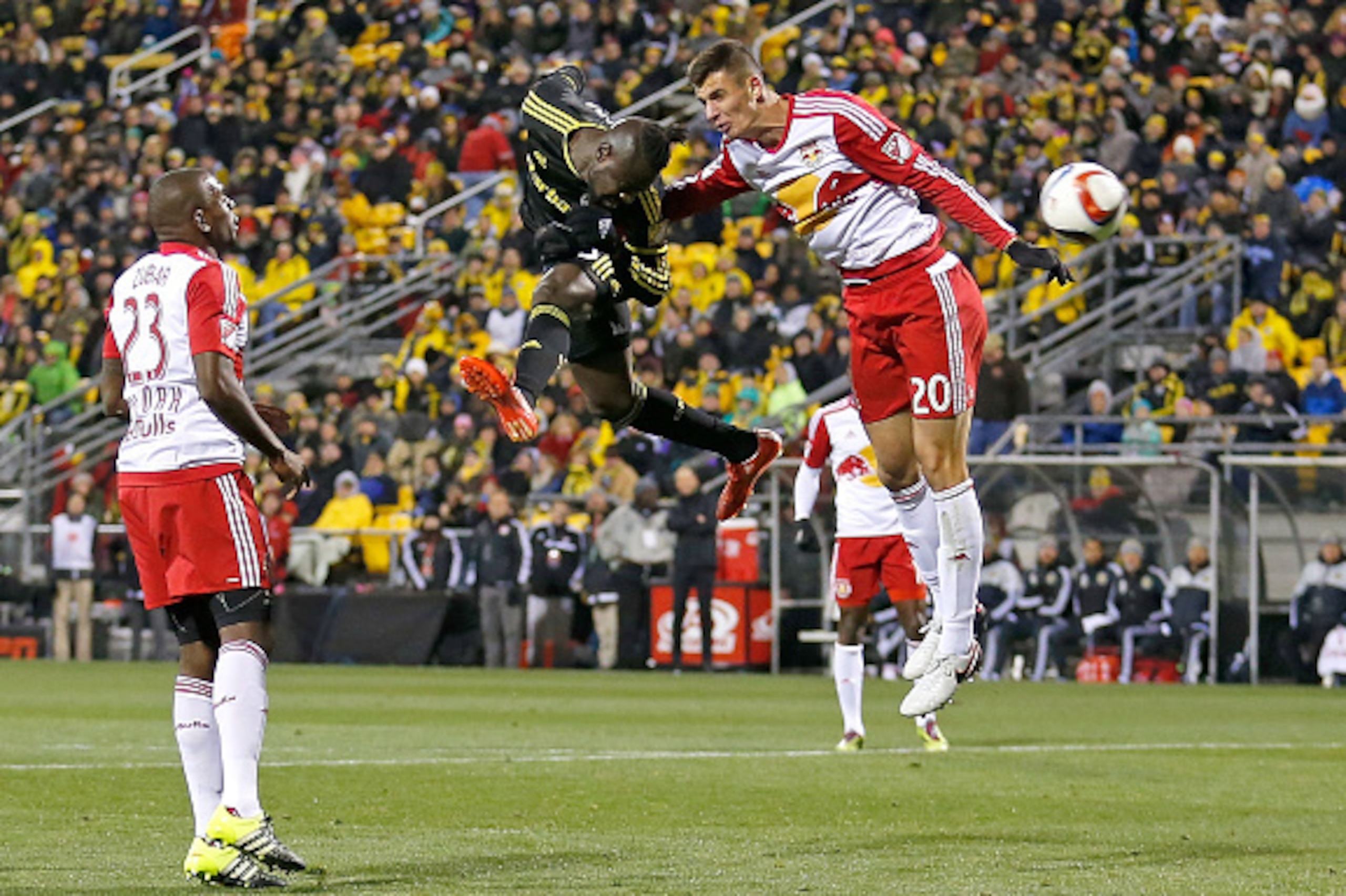 COLUMBUS, OH - NOVEMBER 22:  Kei Kamara #23 of the Columbus Crew SC heads the ball past Matt Miazga #20 of the New York Red Bulls during the first half on November 22, 2015 at MAPFRE Stadium in Columbus, Ohio. (Photo by Kirk Irwin/Getty Images)