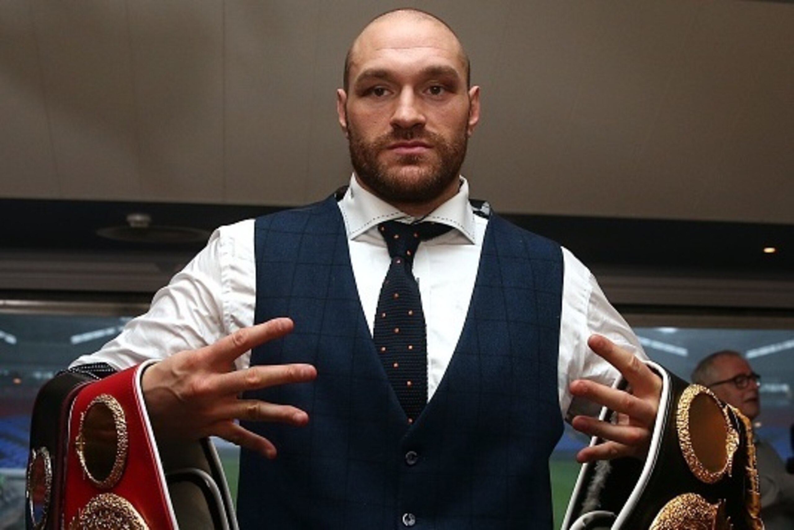 BOLTON, ENGLAND - NOVEMBER 30: Tyson Fury poses with his belts following a press conference at the Macron Stadium on November 30, 2015 in Bolton, England. (Photo by Chris Brunskill/Getty Images)