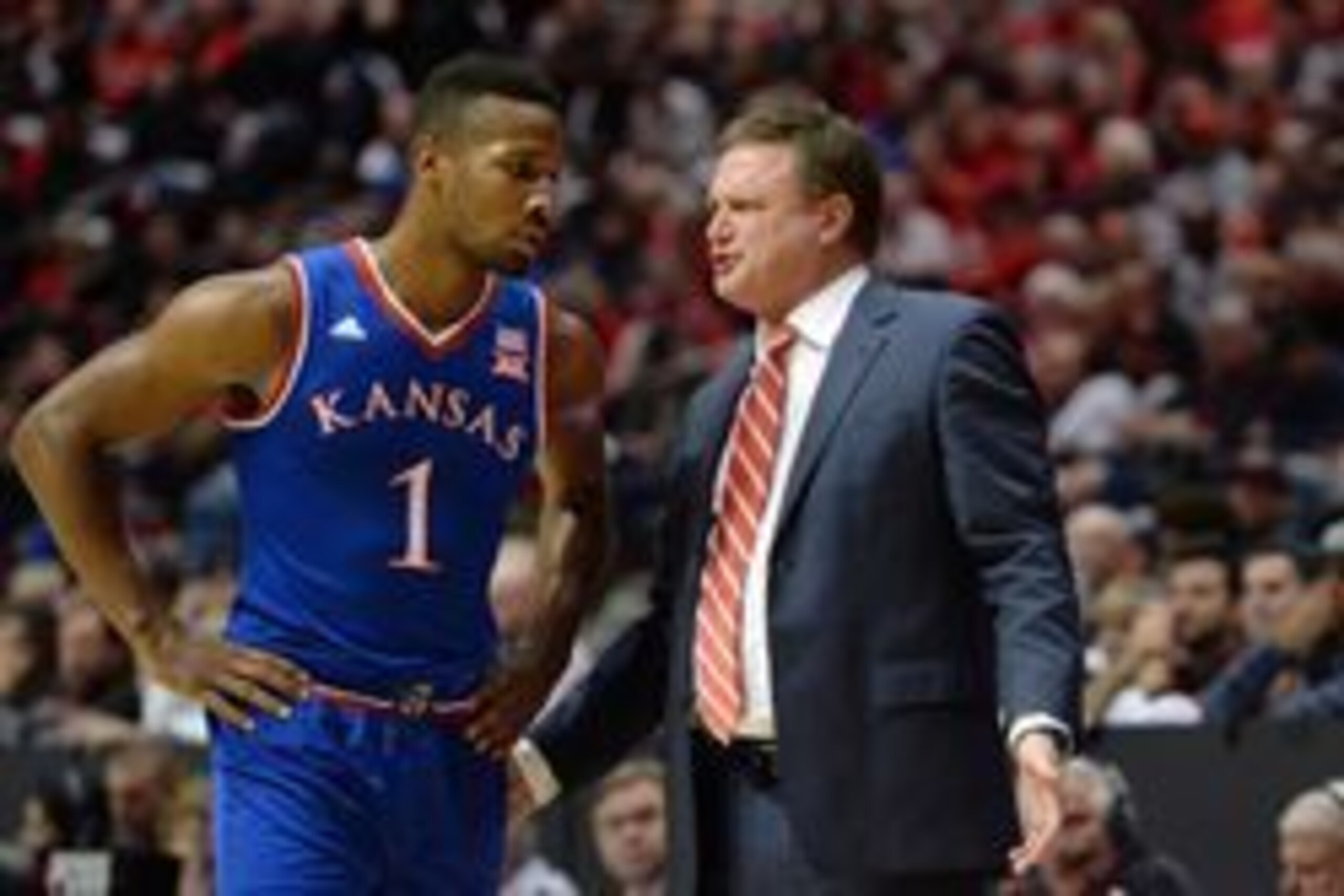 Dec 22, 2015; San Diego, CA, USA; Kansas Jayhawks head coach Bill Self talks to guard Wayne Selden Jr. (1) during the first half against the San Diego State Aztecs at Viejas Arena at Aztec Bowl. Mandatory Credit: Jake Roth-USA TODAY Sports Dec 22, 2015; San Diego, CA, USA; Kansas Jayhawks head coach Bill Self talks to guard Wayne Selden Jr. (1) during the first half against the San Diego State Aztecs at Viejas Arena at Aztec Bowl. Mandatory Credit: Jake Roth-USA TODAY Sports
