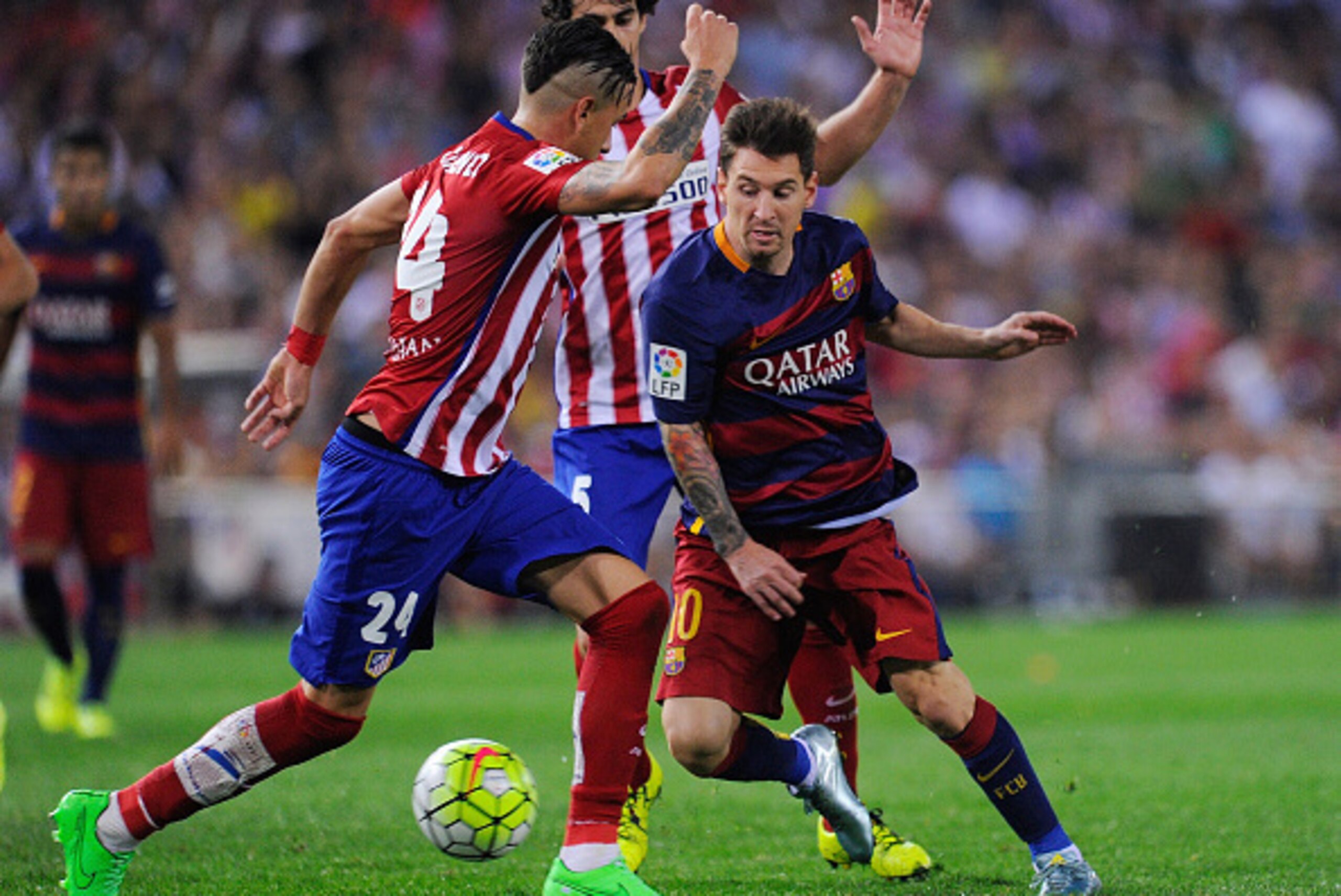 MADRID, SPAIN - SEPTEMBER 12:   Lionel Messi of FC Barcelona takes on Jose Maria Gimenez of Club Atletico de Madrid
during the La Liga match between Club Atletico de Madrid and FC Barcelona at Vicente Calderon Stadium on September 12, 2015 in Madrid, Spai
