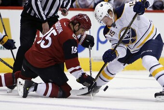 Eichel battles for the puck against the Arizona Coyotes.