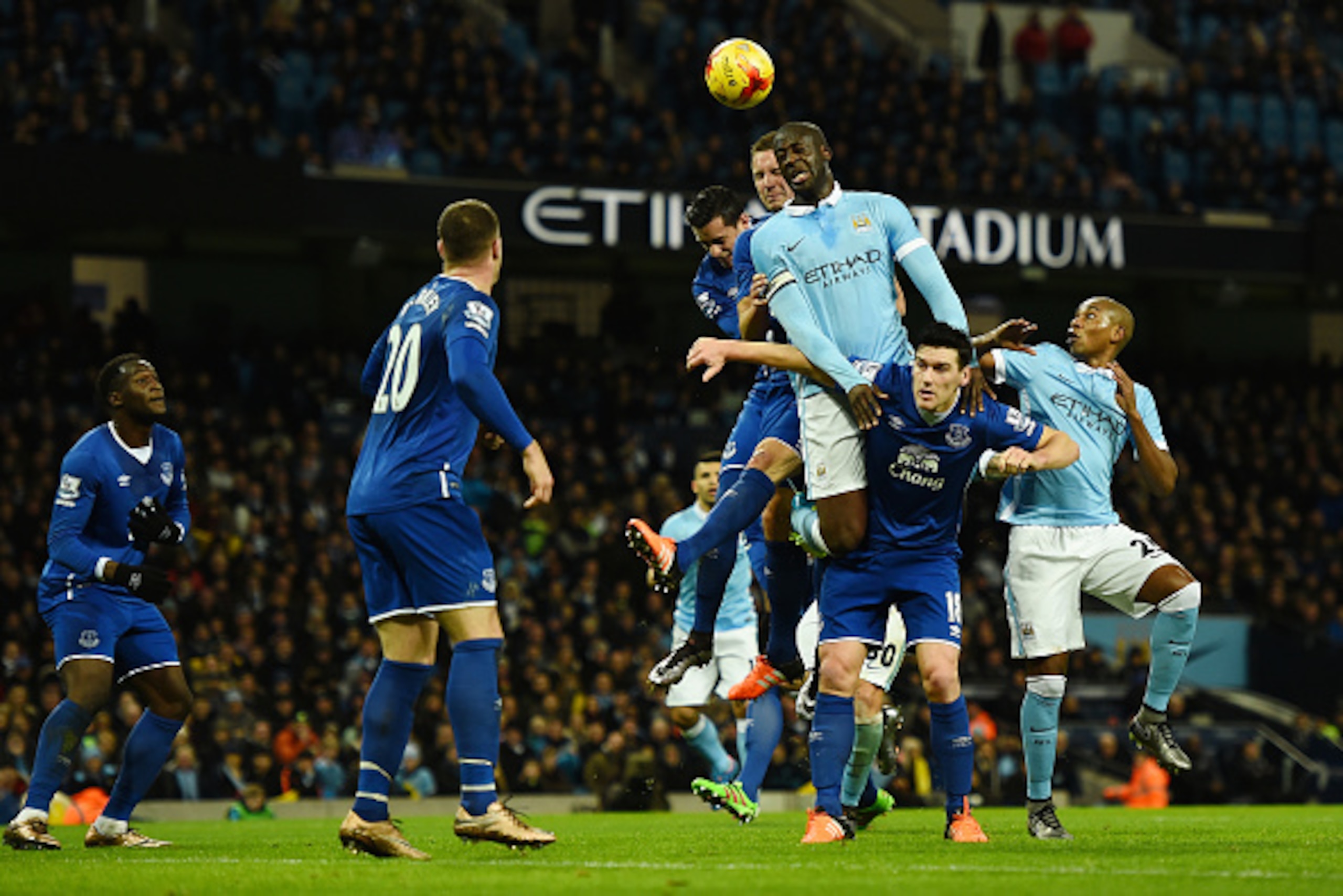 MANCHESTER, ENGLAND - JANUARY 27:  Yaya Toure of Manchester City rises above the Everton defence to win a header during the Capital One Cup Semi Final, second leg match between Manchester City and Everton at the Etihad Stadium on January 27, 2016 in Manch