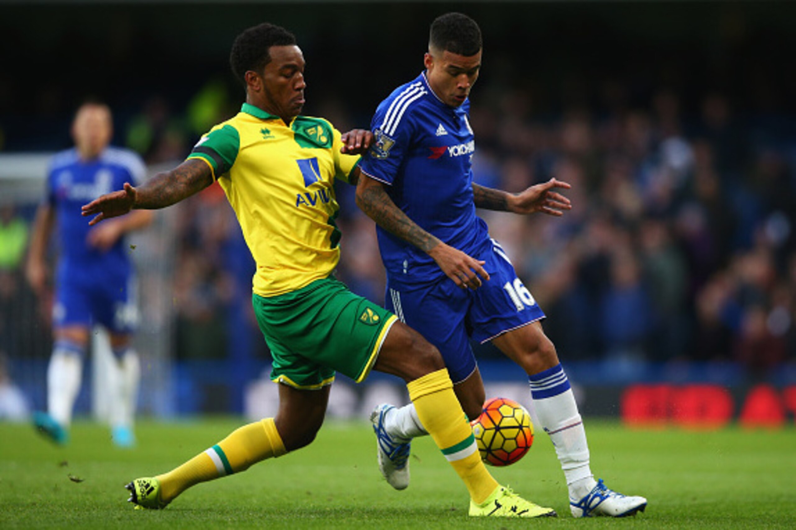 LONDON, ENGLAND - NOVEMBER 21: Kenedy of Chelsea and Andre Wisdom of Norwich City compete for the ball during the Barclays Premier League match between Chelsea and Norwich City at Stamford Bridge on November 21, 2015 in London, England.  (Photo by Paul Gi