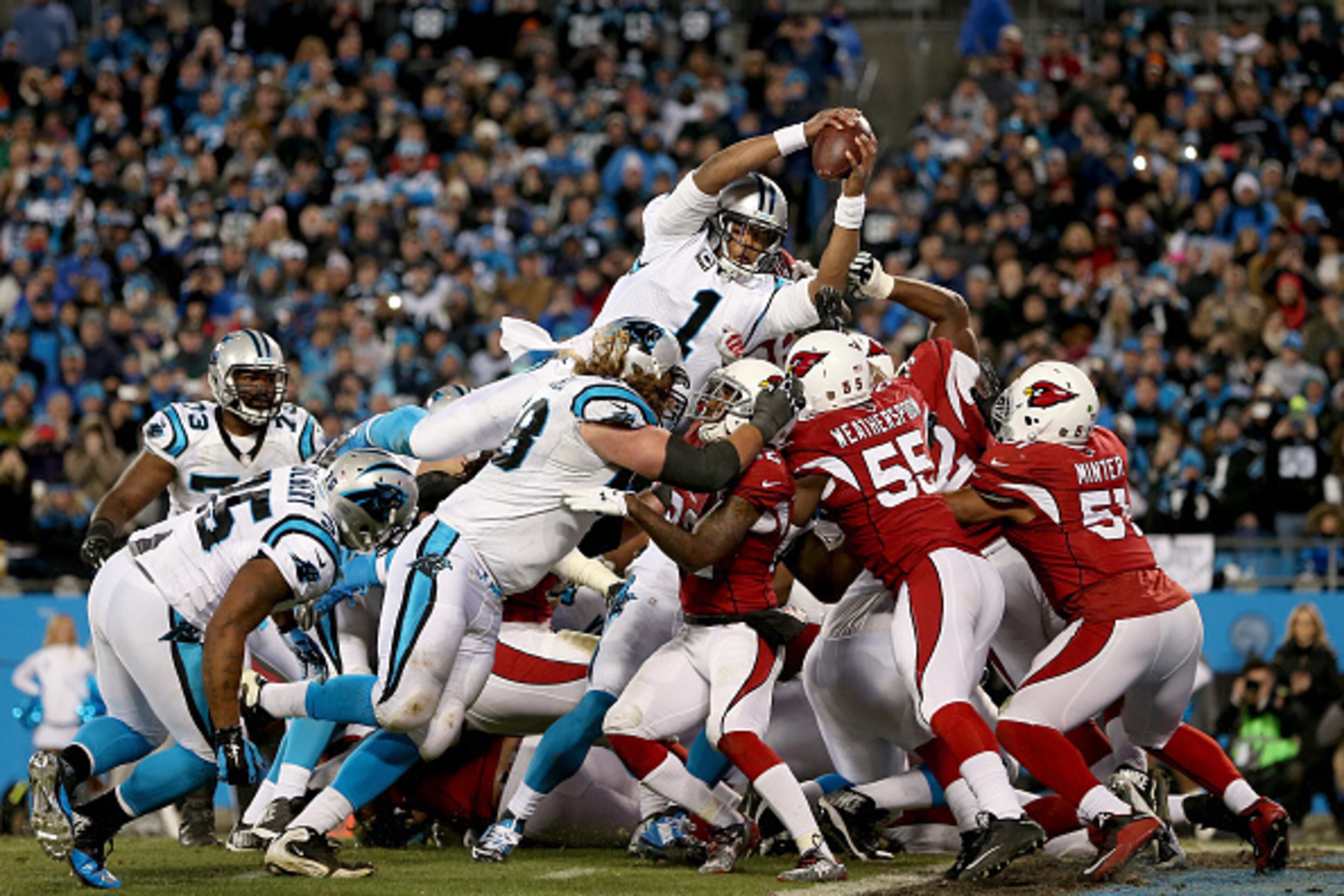 CHARLOTTE, NC - JANUARY 24:  Cam Newton #1 of the Carolina Panthers scores a touchdown in the second quarter against the Arizona Cardinals during the NFC Championship Game at Bank of America Stadium on January 24, 2016 in Charlotte, North Carolina.  (Phot