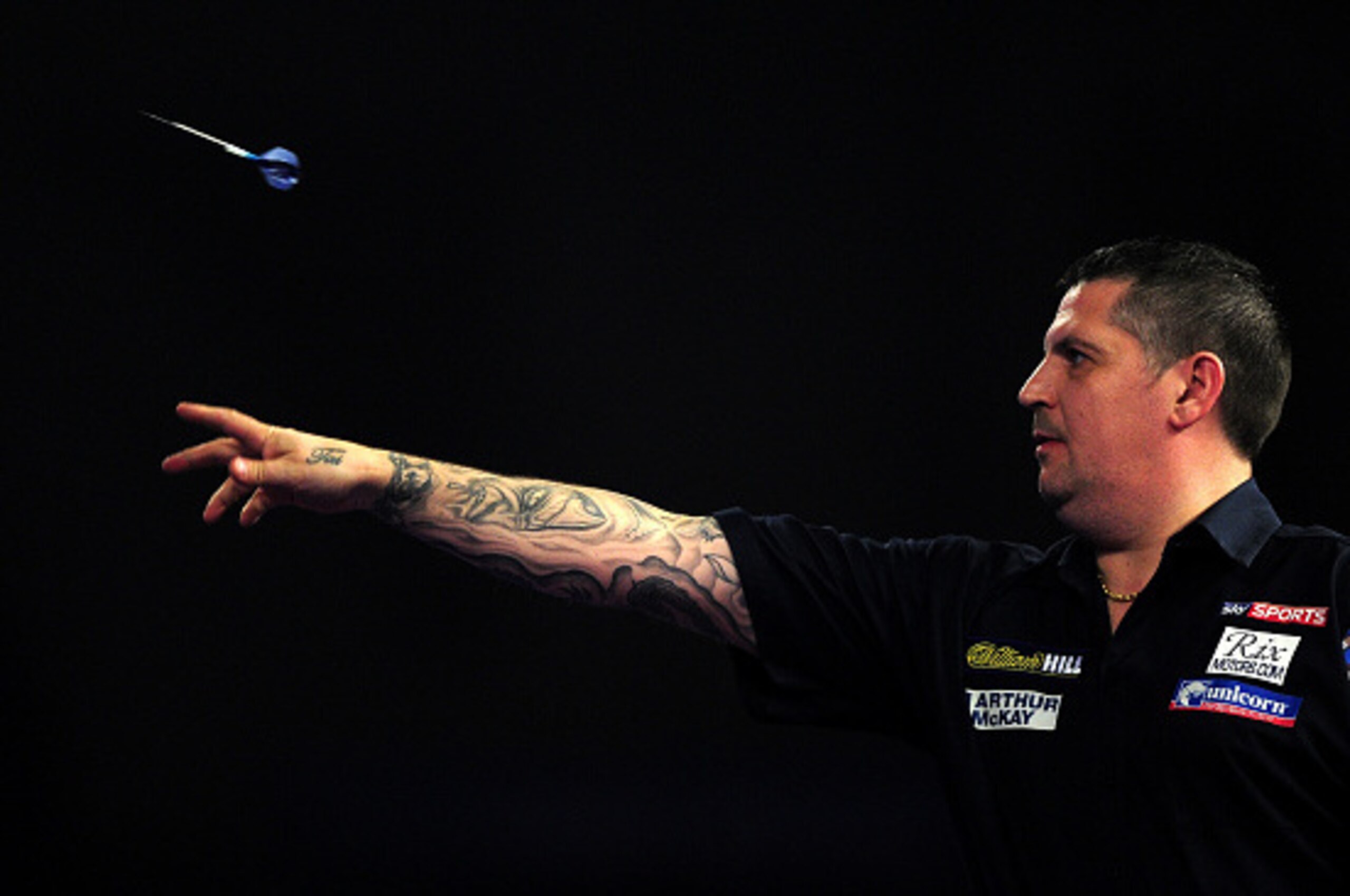 LONDON, ENGLAND - JANUARY 03:  Gary Anderson of Scotland throws during the final match against Adrian Lewis of England during Day Fifteen of the 2016 William Hill PDC World Darts Championships at Alexandra Palace on January 3, 2016 in London, England.  (P