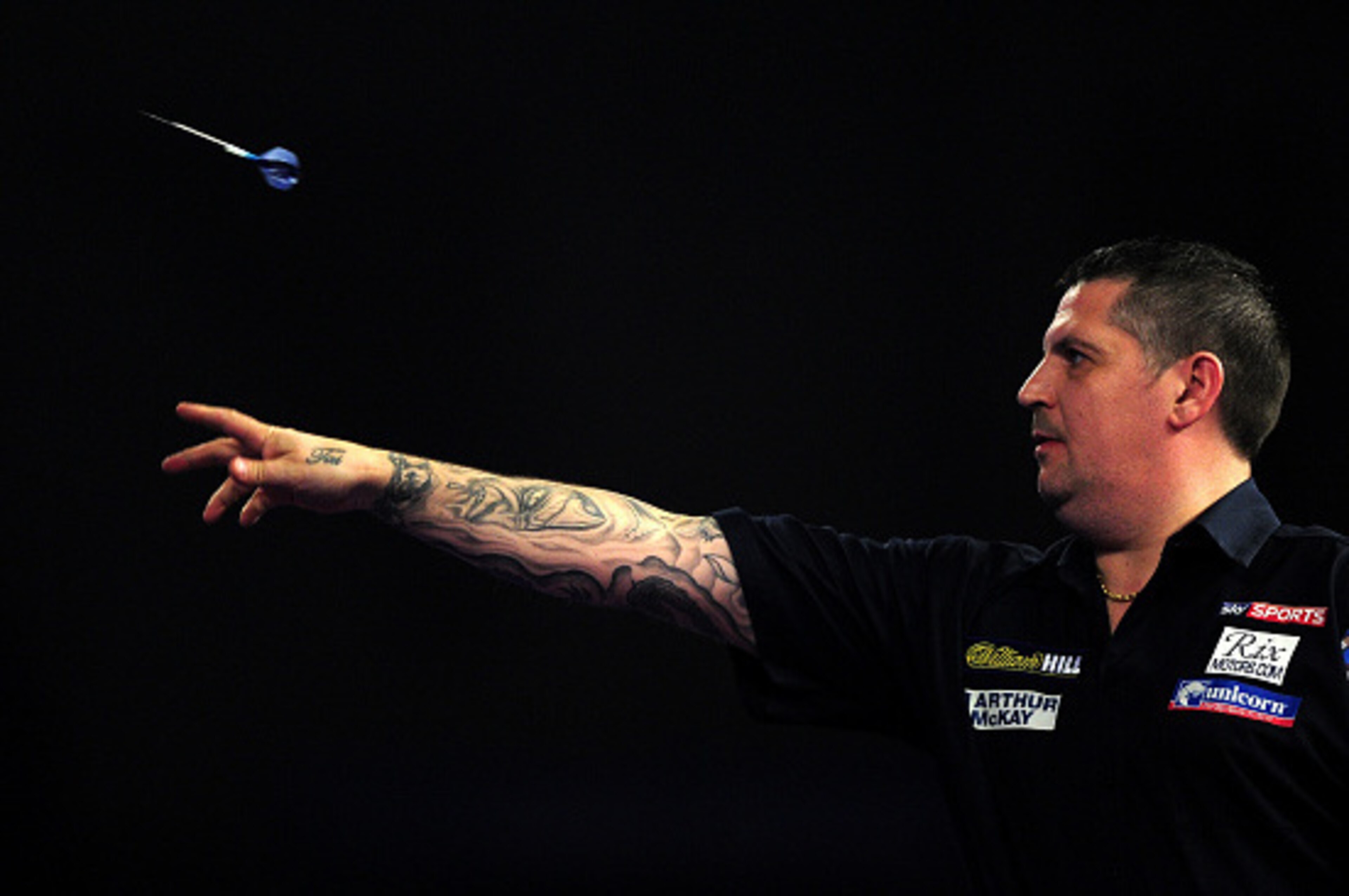 LONDON, ENGLAND - JANUARY 03:  Gary Anderson of Scotland throws during the final match against Adrian Lewis of England during Day Fifteen of the 2016 William Hill PDC World Darts Championships at Alexandra Palace on January 3, 2016 in London, England.  (P