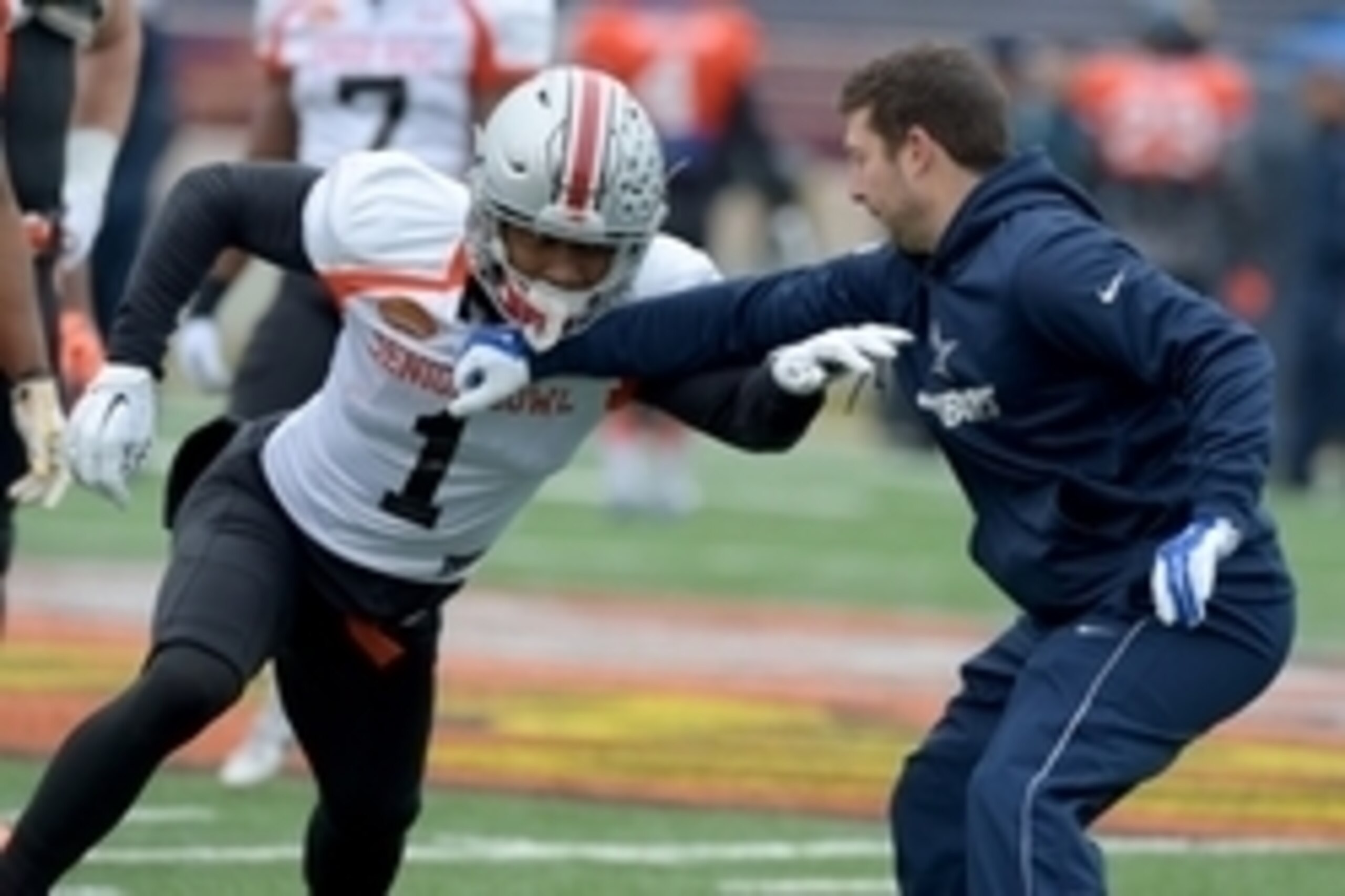 Jan 27, 2016; Mobile, AL, USA; North squad wide receiver Braxton Miller of Ohio State (1) works against a Dallas Cowboys assistant coach on a drill during Senior Bowl practice at Ladd-Peebles Stadium. Mandatory Credit: Glenn Andrews-USA TODAY Sports