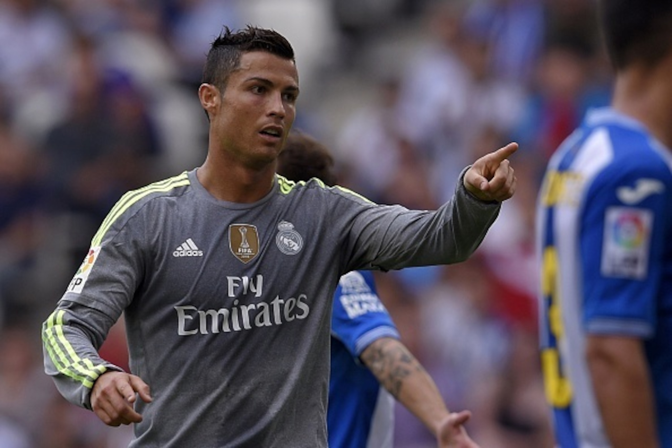 Real Madrid's Portuguese forward Cristiano Ronaldo reacts after scoring during the Spanish league football match RCD Espanyol vs Real Madrid CF at the Power8 stadium in Cornella de Llobregat on September 12, 2015. AFP PHOTO/ LLUIS GENE (Photo credi Real Madrid's Portuguese forward Cristiano Ronaldo reacts after scoring during the Spanish league football match RCD Espanyol vs Real Madrid CF at the Power8 stadium in Cornella de Llobregat on September 12, 2015. AFP PHOTO/ LLUIS GENE (Photo credi