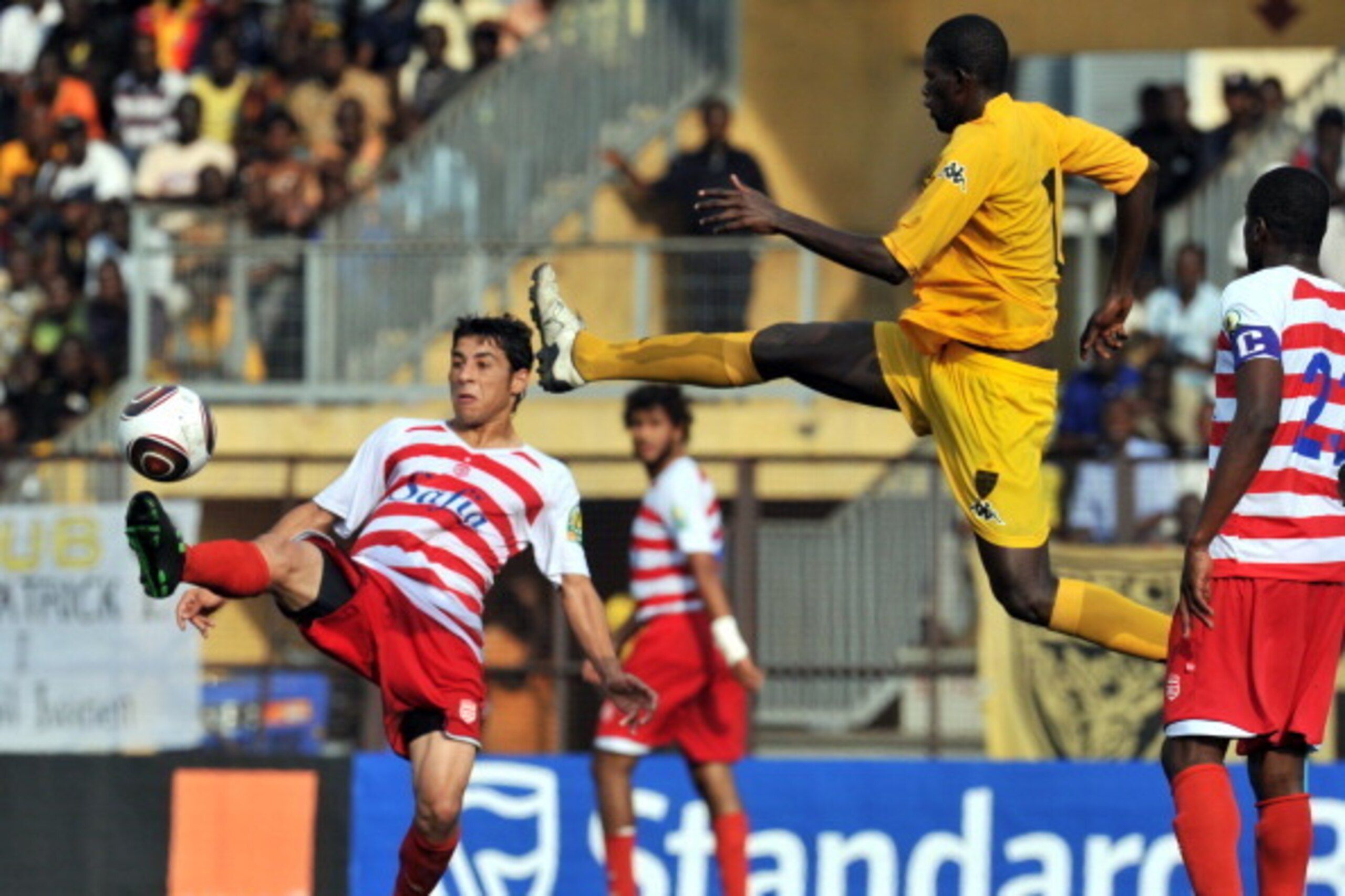Asec d'Abidjan player Boua Koffi (C) vies with Club Africain de Tunis on July 17, 2011 during their CAF confederation Cup football match at the Rober Champrox stadium in Abidjan. AFP PHOTO / ISSOUF SANOGO (Photo credit should read ISSOUF SANOGO/AFP/Getty 