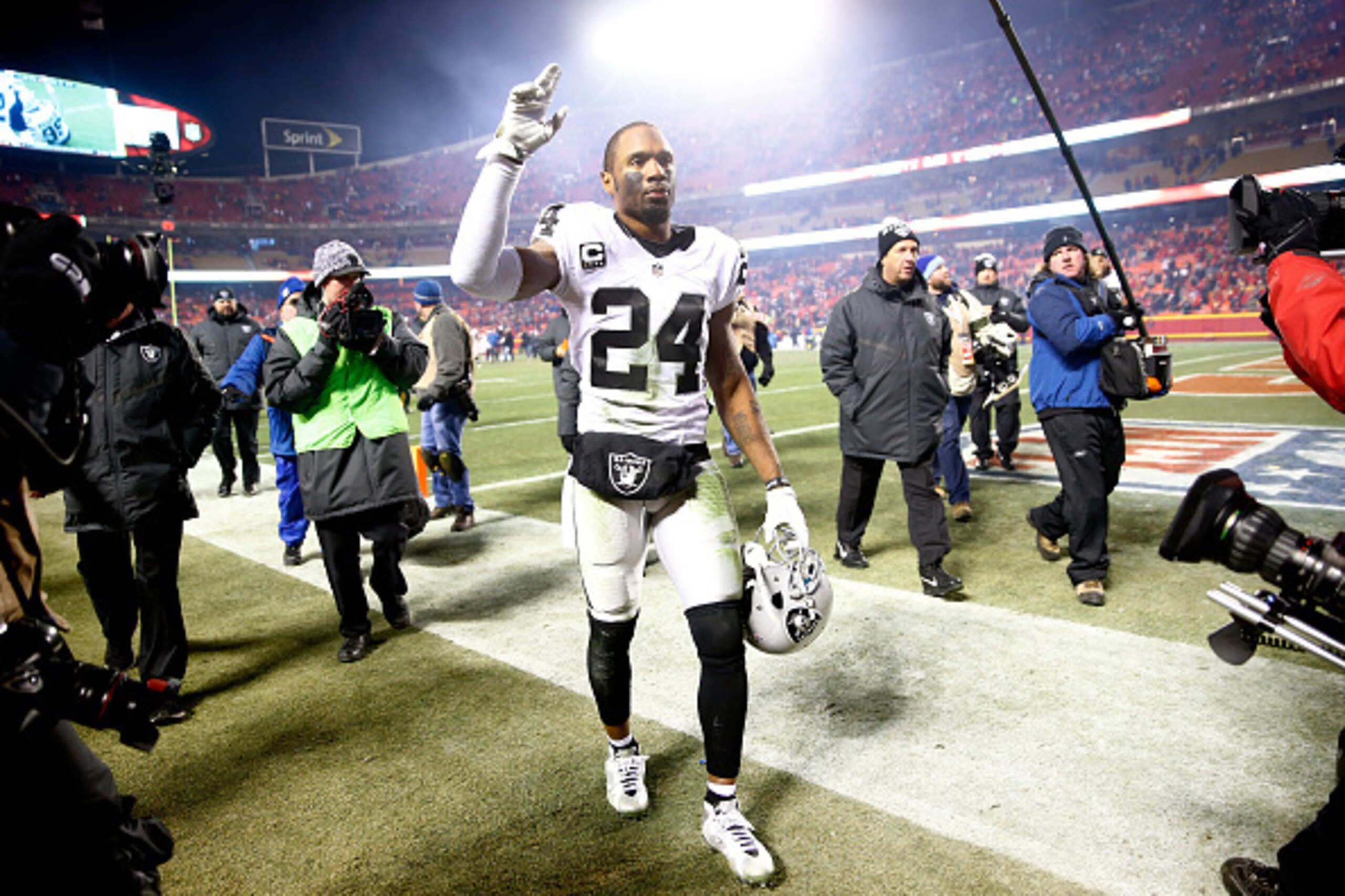KANSAS CITY, MO - JANUARY 03: Free safety Charles Woodson #24 of the Oakland Raiders waves to the crowd as he walks off the field following the Raiders 23-17 loss to the Kansas City Chiefs in the game at Arrowhead Stadium on January 3, 2016 in Kansas Cit KANSAS CITY, MO - JANUARY 03: Free safety Charles Woodson #24 of the Oakland Raiders waves to the crowd as he walks off the field following the Raiders 23-17 loss to the Kansas City Chiefs in the game at Arrowhead Stadium on January 3, 2016 in Kansas Cit