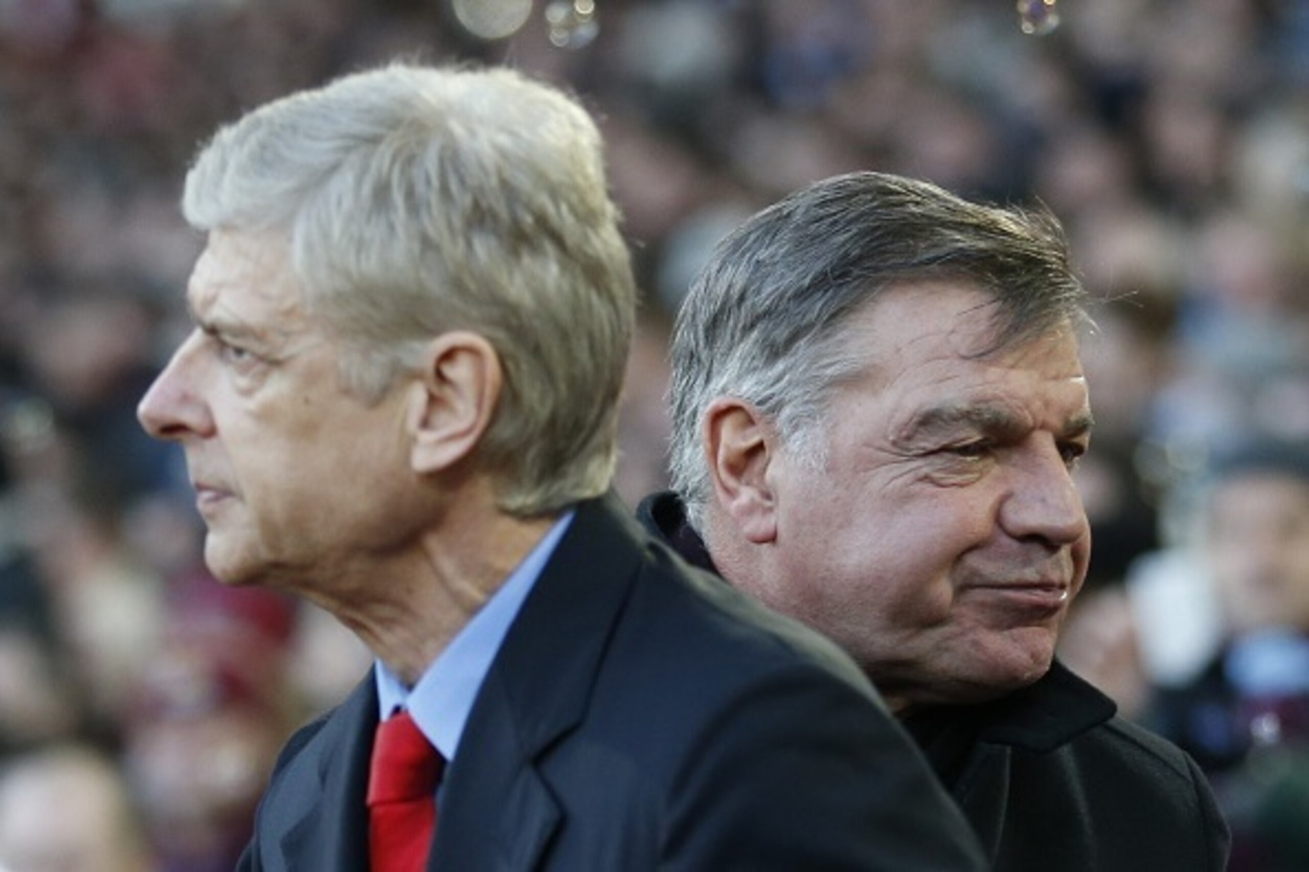 West Ham United's English manager Sam Allardyce (R) greets Arsenal's French manager Arsene Wenger (L) ahead of kick off of the English Premier League football match between West Ham United and Arsenal at the Boleyn Ground, Upton Park, in east London, on D