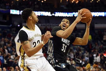 NEW ORLEANS, LA - JANUARY 19:  Karl-Anthony Towns #32 of the Minnesota Timberwolves works against Anthony Davis #23 of the New Orleans Pelicans during the second half of a game at the Smoothie King Center on January 19, 2016 in New Orleans, Louisiana. New