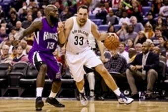 Jan 28, 2016; New Orleans, LA, USA; New Orleans Pelicans forward Ryan Anderson (33) dribbles the ball around Sacramento Kings forward Quincy Acy (13) during the second half at the Smoothie King Center. The Pelicans won 114-105. Mandatory Credit: Derick E.