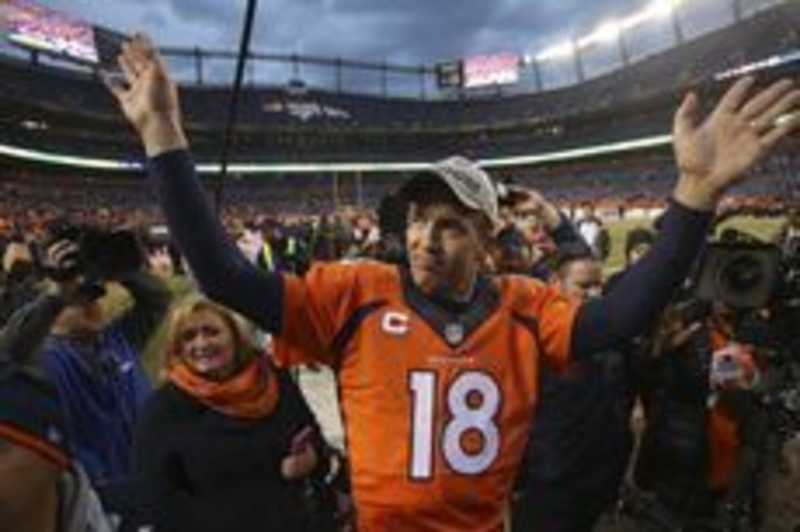 Jan 24, 2016; Denver, CO, USA; Denver Broncos quarterback Peyton Manning (18) waves to fans after  the AFC Championship football game at Sports Authority Field at Mile High.Denver Broncos defeated New England Patriots 20-18 to earn a trip to Super Bowl 50